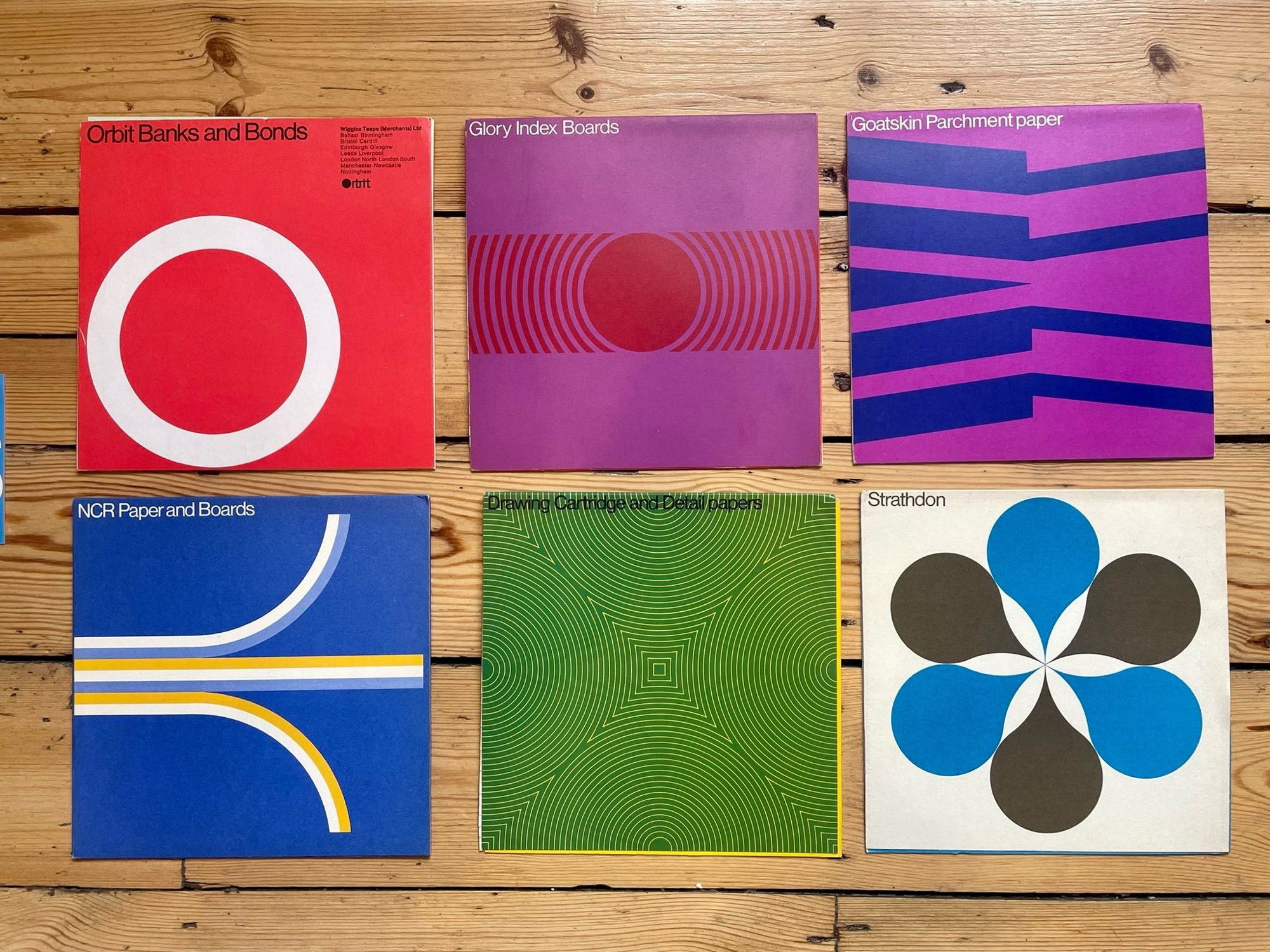 Collection of a variety of six colorful paper sample books with striking cover designs c. 1960s from Matt Lamont of designreviewed.com