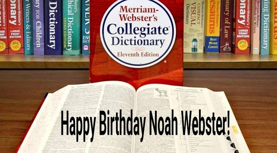 Text: Happy Birthday Noah Webster.
Photo: Various copies of Webster's dictionaries in different colours on a shelf. Perhaps the shelf is located in a theatre. 