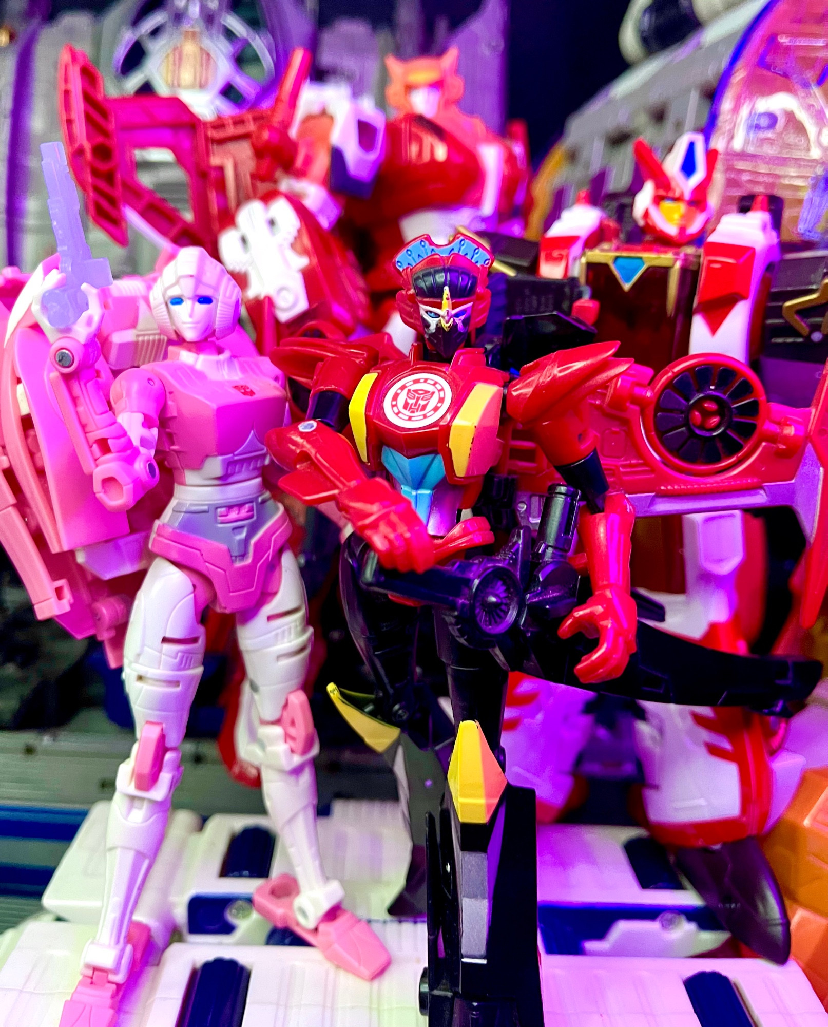 Earthrise Arcee, RID Windblade, Legacy Override, and POTP Elita 1 standing together 