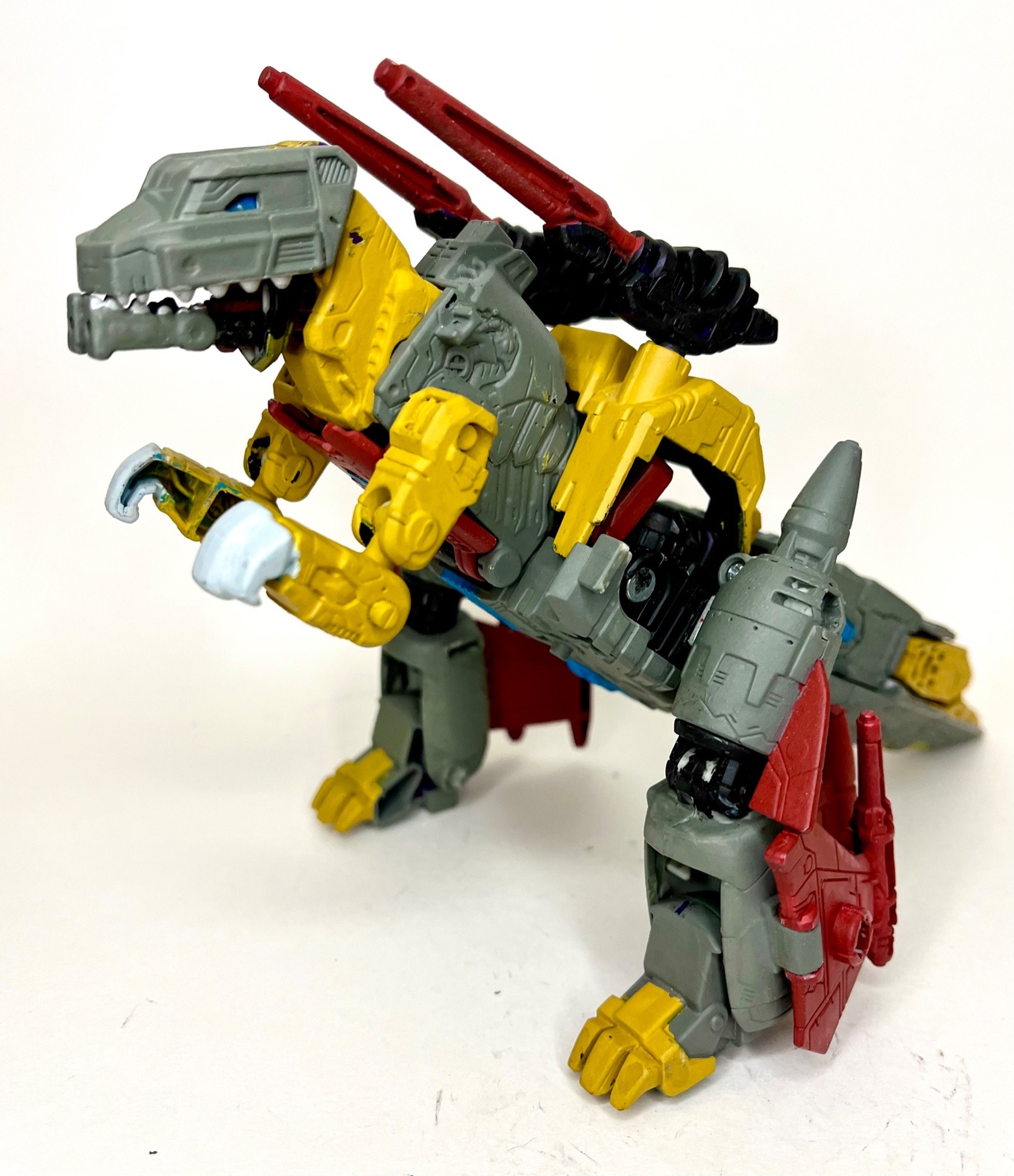 An Earthrise Snapdragon custom painted into Grimlock, dino mode