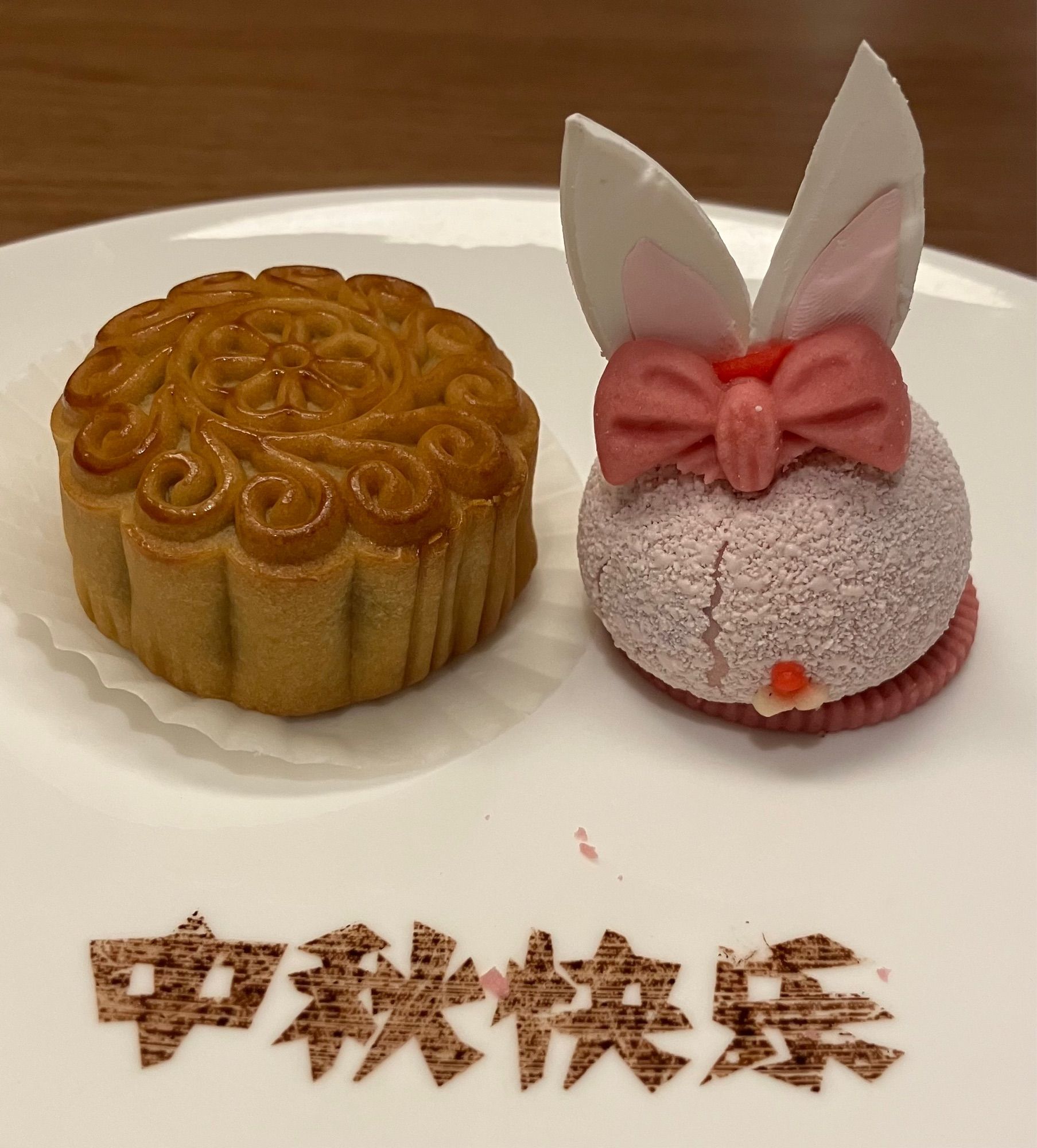 A moon cake and a cake shaped like a rabbit.