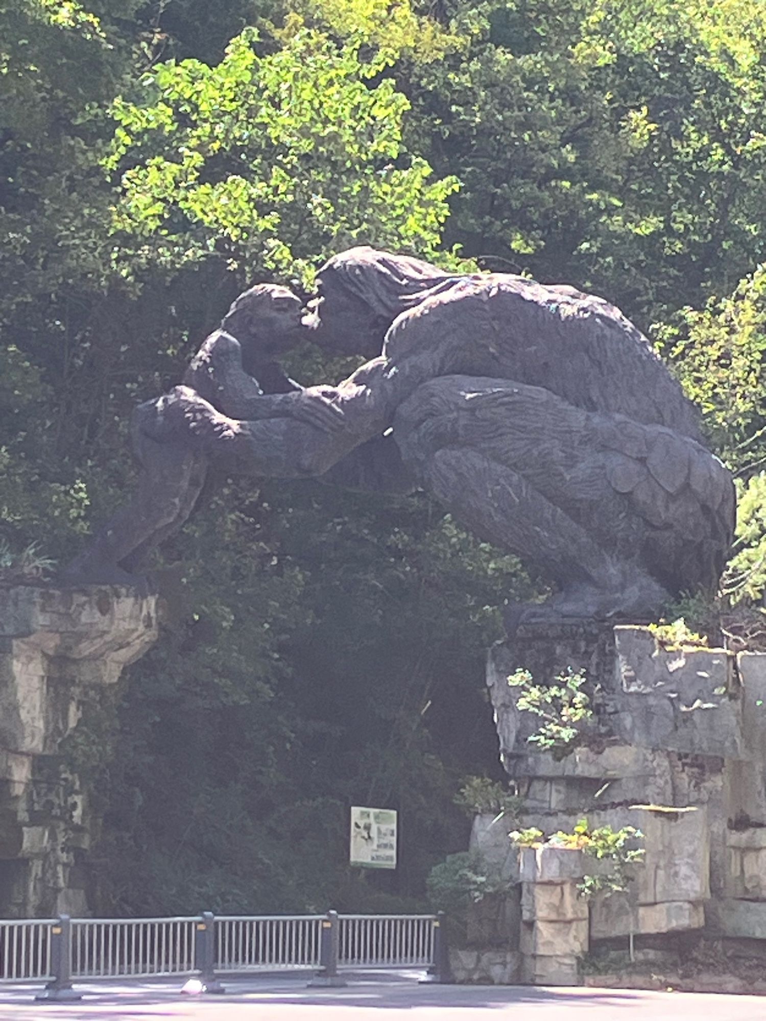 Entrance road to the park with an archway over it made of a large yeren kissing a smaller yeren.