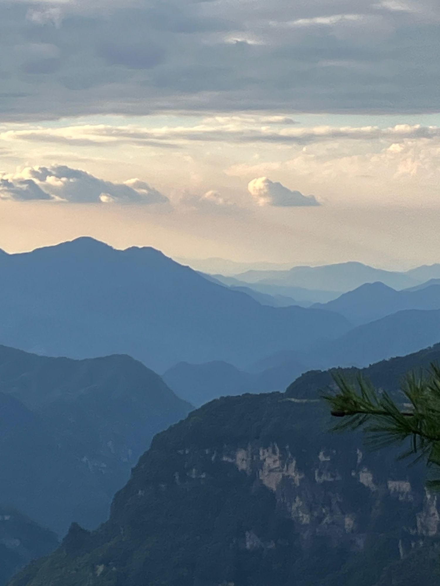 View of mountains with more mountains in the far distance and strange cloud formations