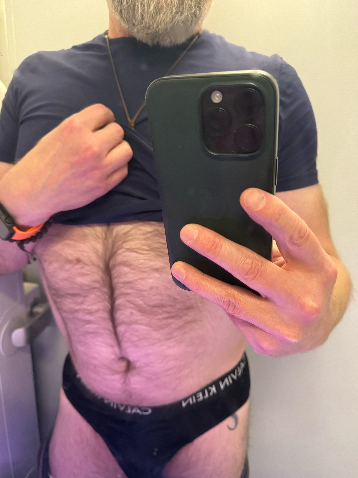 Hairy male wearing black briefs