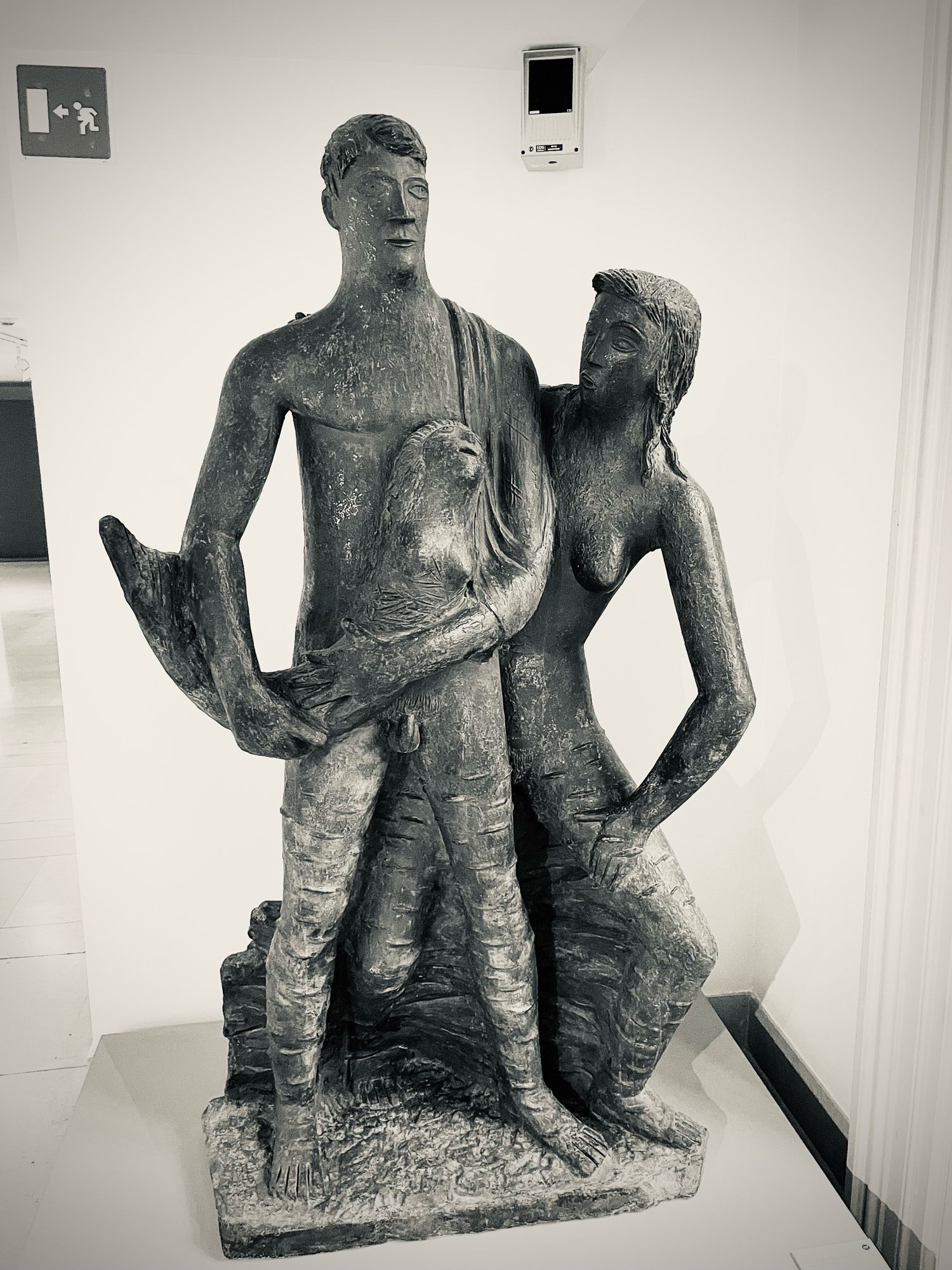 A bronze statue of male and female human figures.  The man is holding what I assume is supposed to be a mermaid but looks more like Billy the Fish from the esteemed British publication Viz.  It’s even got his mullet.