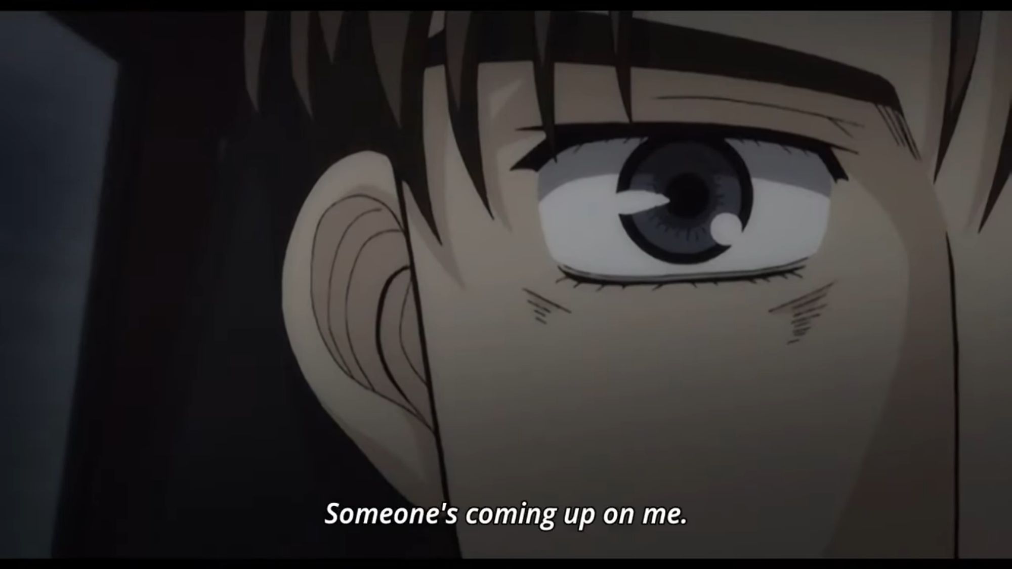 Screenshot of the anime Initial D Fourth Stage with a close up of Takumi's eye, he's saying "Someone's coming up on me."