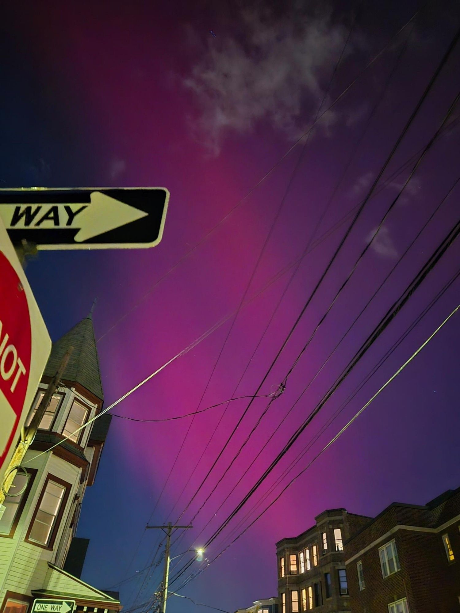 pink aurora over downtown Boston townhouses and a one way sign, very saturated, much better than the other pics posted up thread