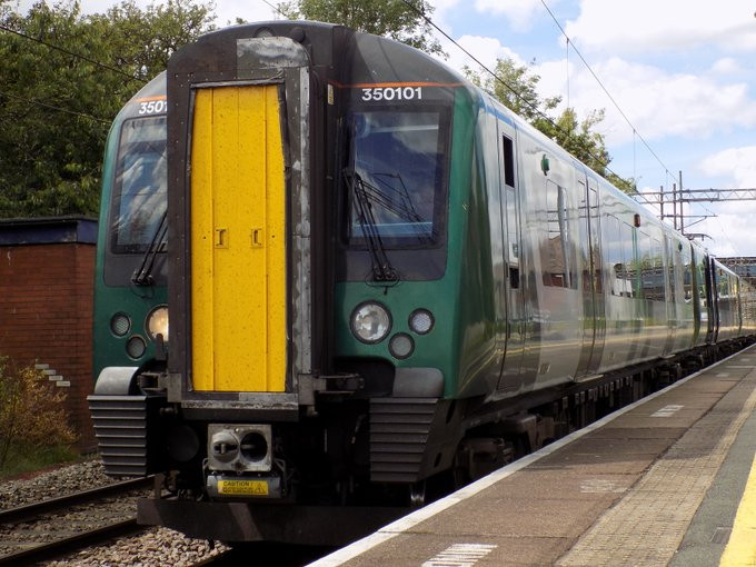 A zoomed-in photo of a Siemens Class 350 Desiro train in London Northwestern Railway livery, loading passengers at Acton Bridge railway station, on a southbound journey from Liverpool Lime Street to Birmingham New Street.