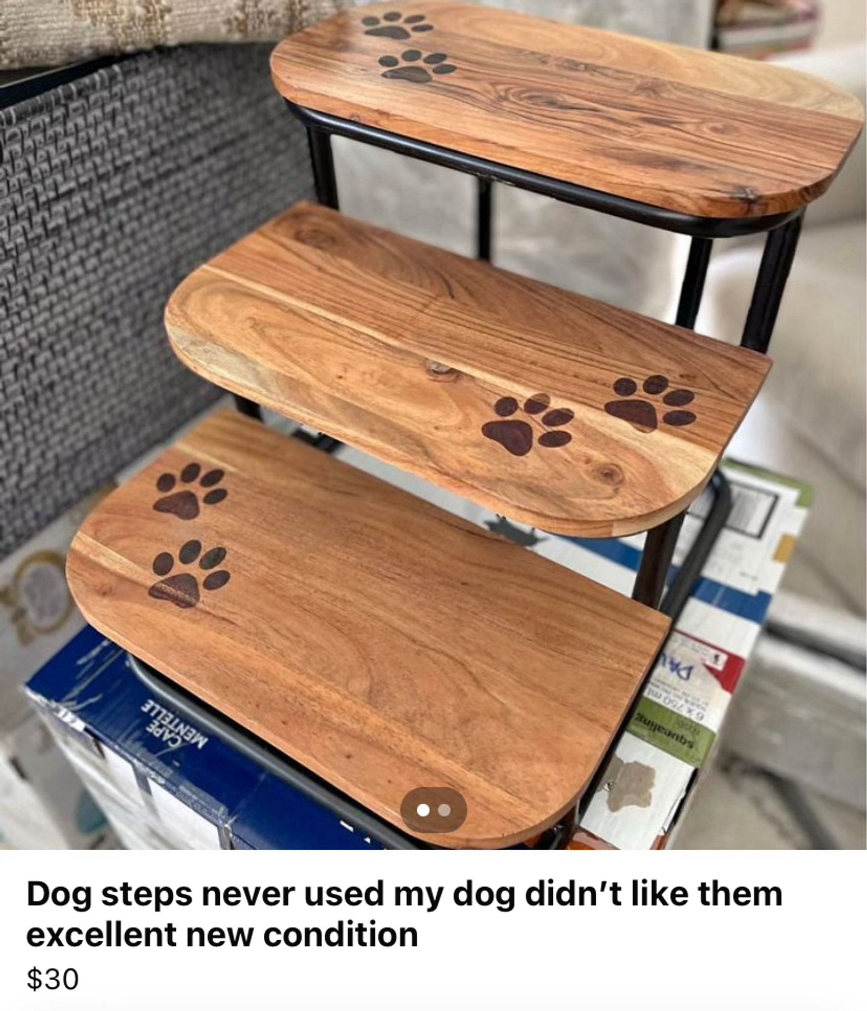 Facebook marketplace listing for a set of small wooden steps with dog paw mark design on each step.

The listing title is: Dog steps never used my dog didn't like them excellent new condition

Priced at $30