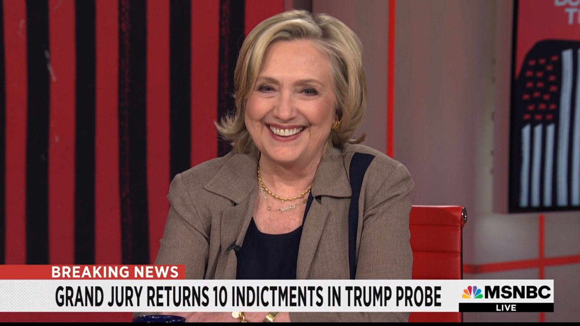 MSNBC lower third: GRAND JURY RETURNS 10 INDICTMENTS IN TRUMP PROBE. Hillary Clinton is onscreen, laughing