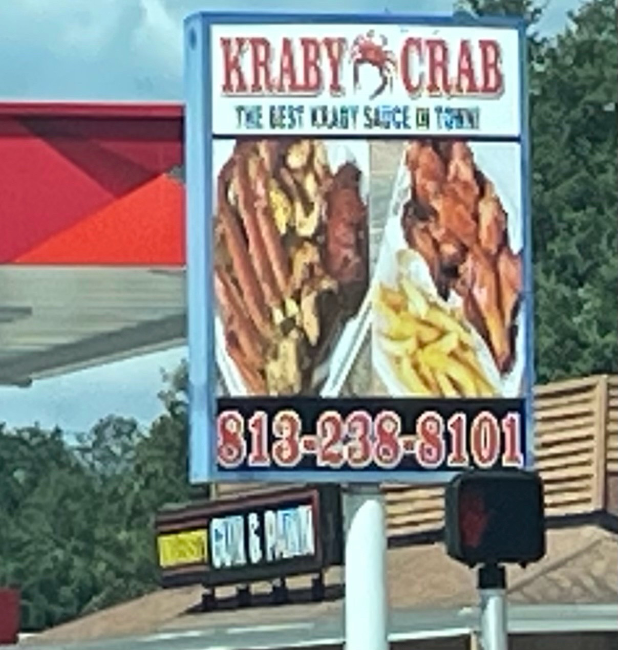 sign outside restaurant. KRABY KRAB: The best Kraby Sauce In Town and two photos of impossible to define food as they are stretched way out of aspect ratio