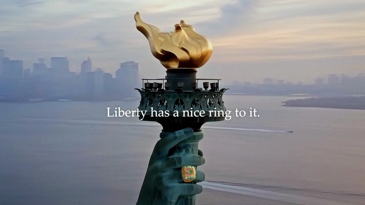 The statue of Liberty with a championship ring. The words onscreen: Liberty has a nice ring to it.