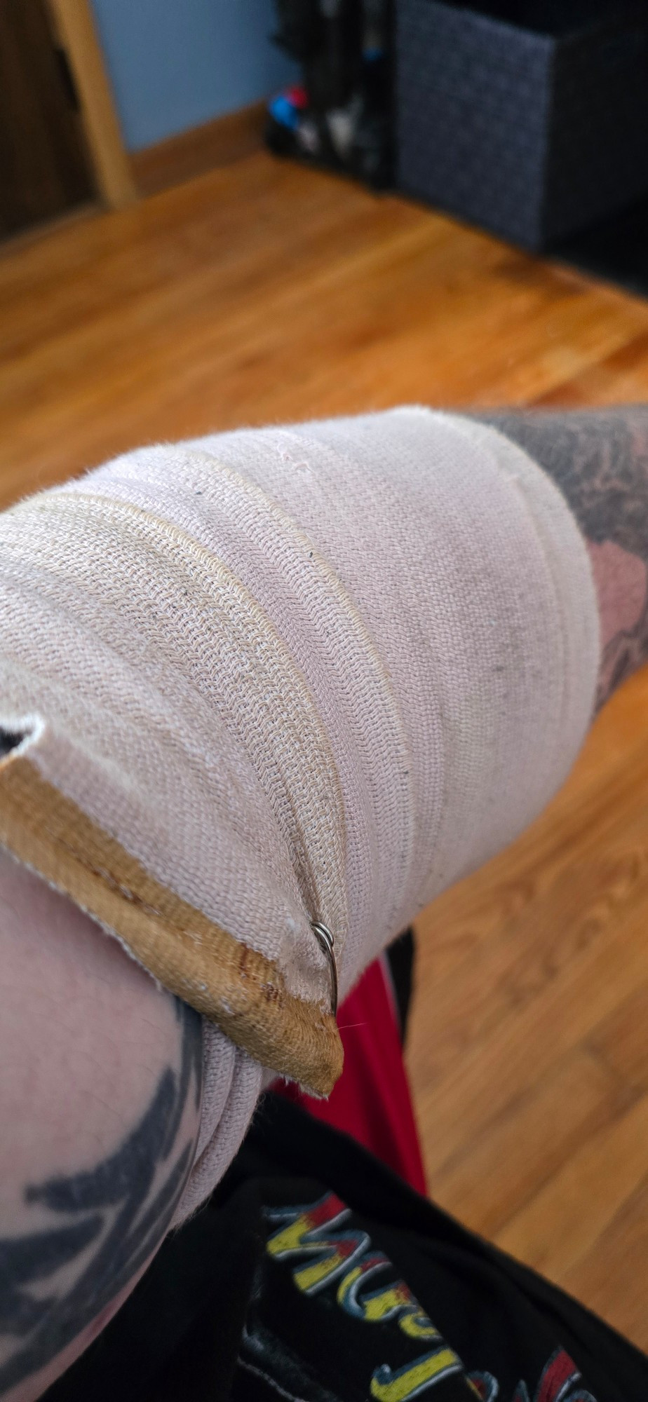 Wrapped elbow with an ace bandage. 