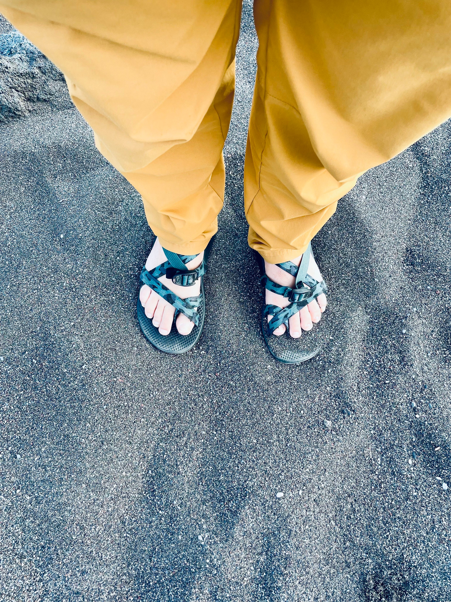 My tootsies on the black sand (volcanic) beach.