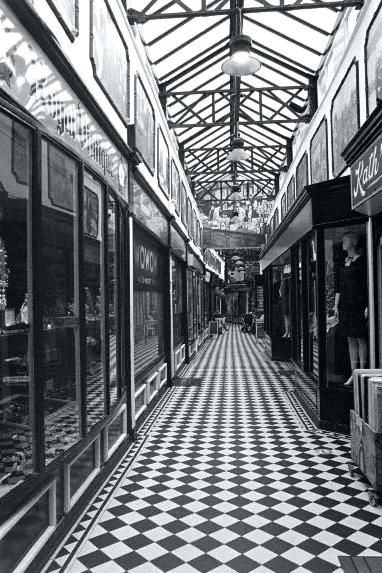 A 35mm black and white film photo of The Royal Arcade, the last of its kind in Wigan and an inspiration for the designer of The Galleries that sadly no longer exists.