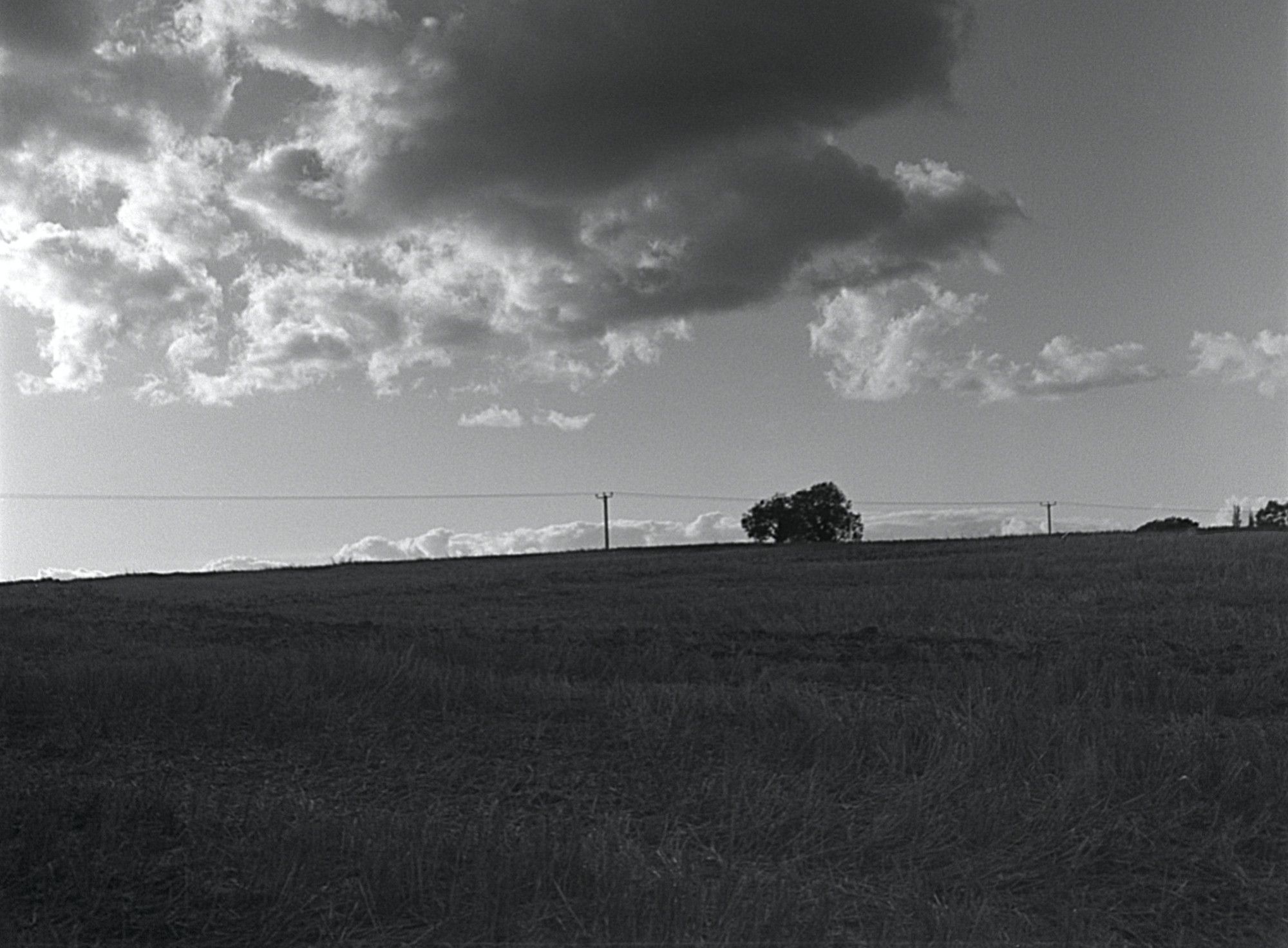 Ominous cloud above the power lines in the distance