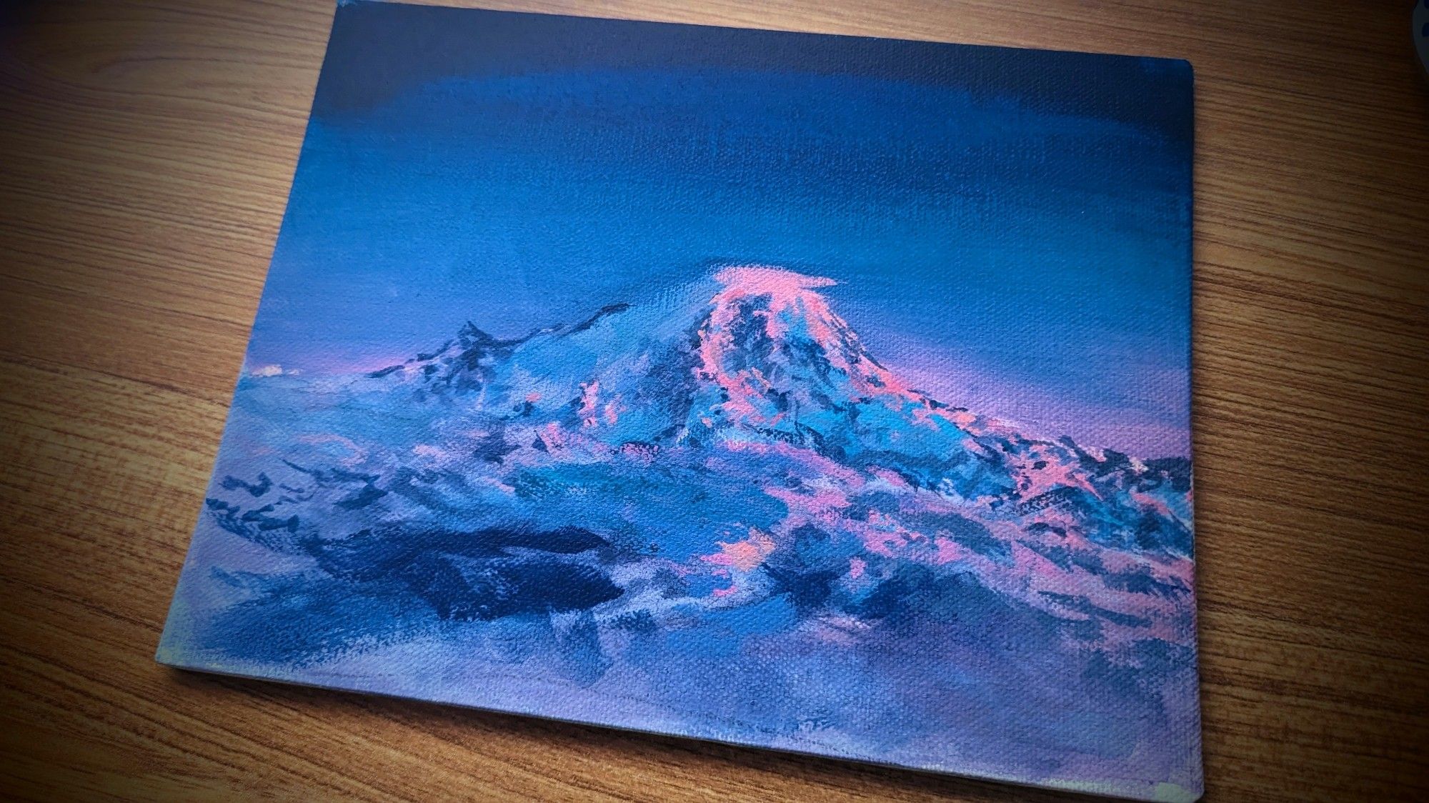 painting of a mountain, lit by the last moments of sunset