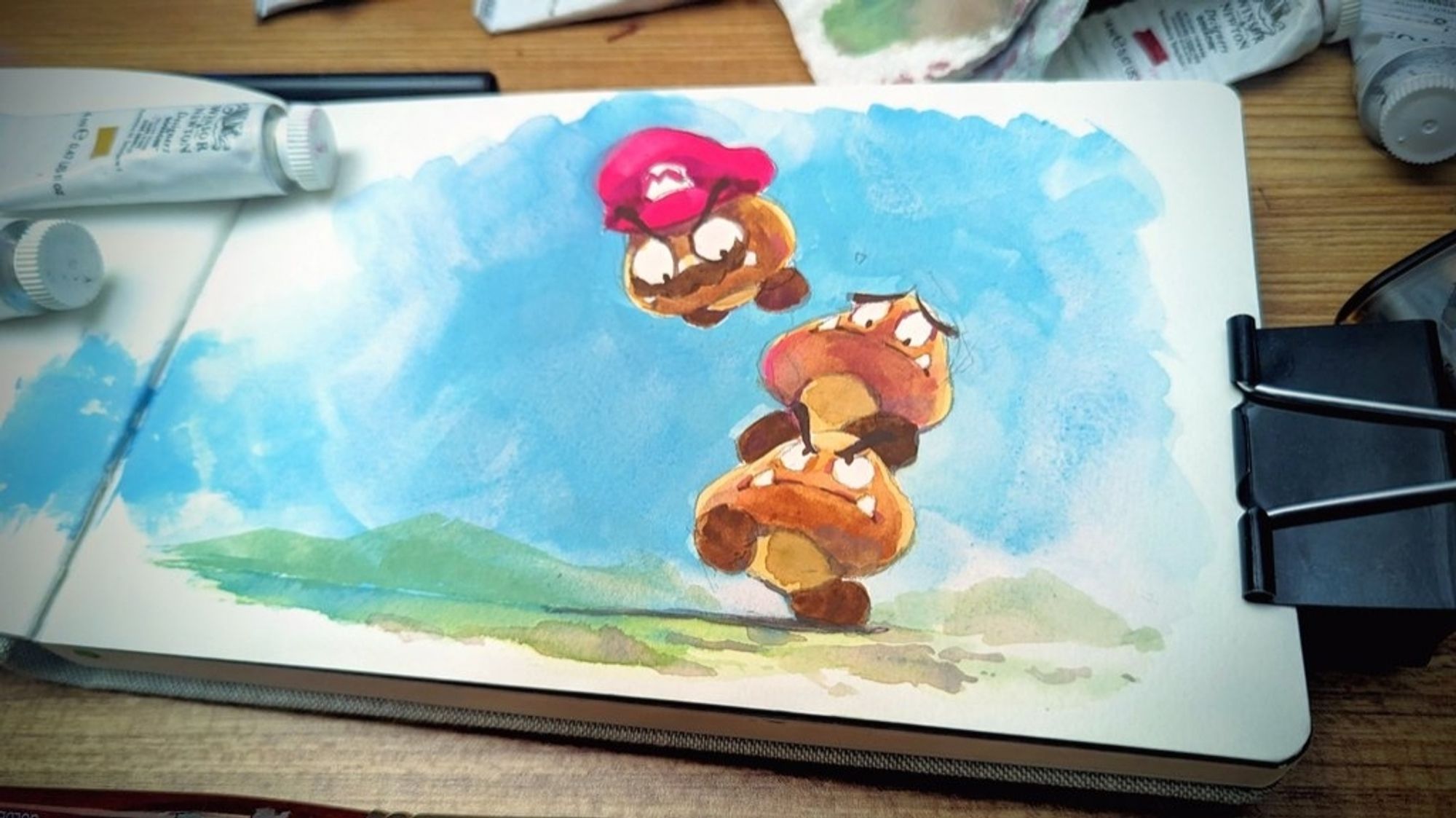 painting of three goombas in a stack, the top one falling off