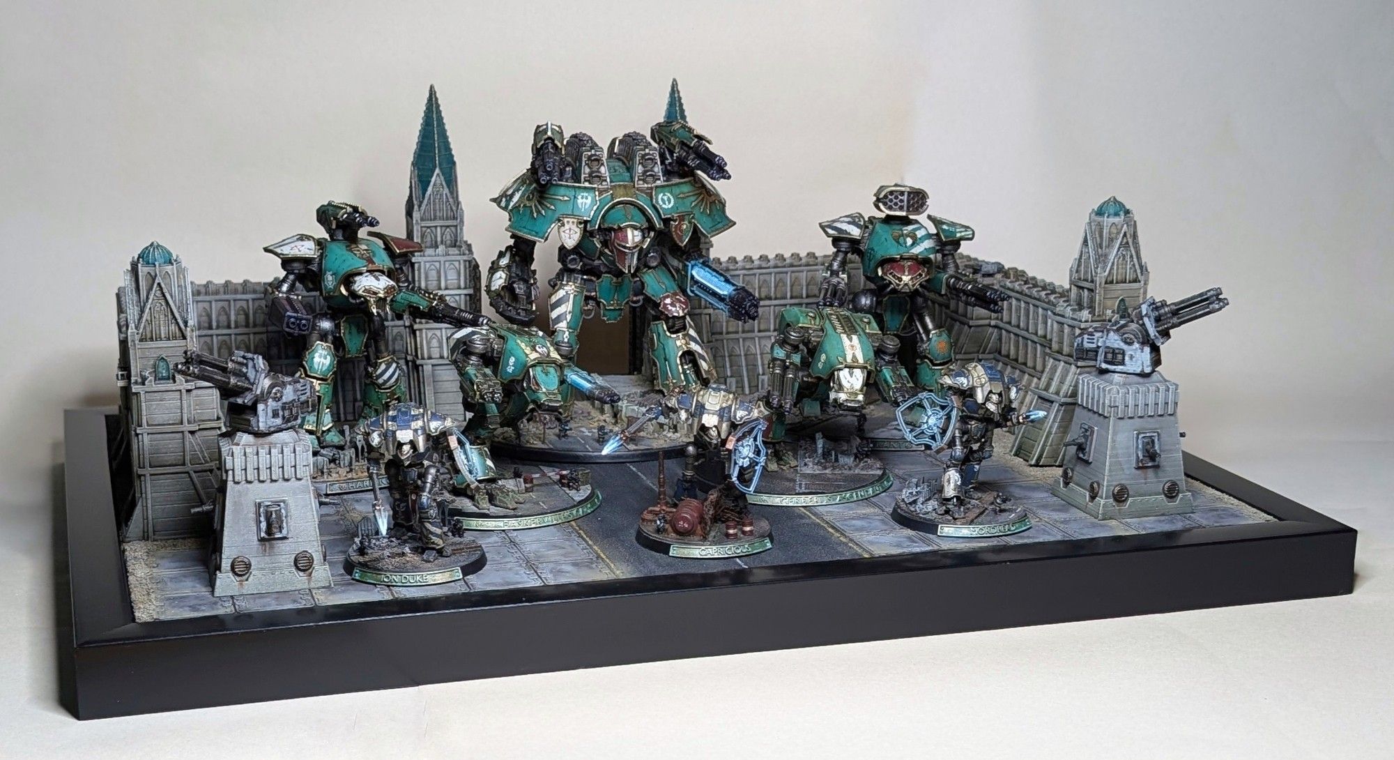 An Armies on Parade board, featuring a Warlord Titan, two Reaver Titans, a pair of Warhound Scout Titans, and a trio of Knight Warsuits.