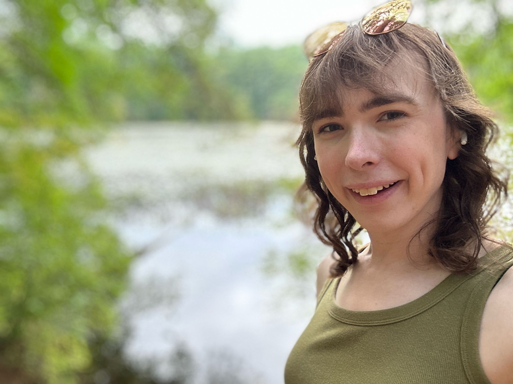 It’s me, Vanessa.  I’m standing in front of a body of water, but because I’m using the iPhone’s portrait mode; you can’t really tell that it’s more of a swampy pond than a beautiful lake.  Either way, I still look good.