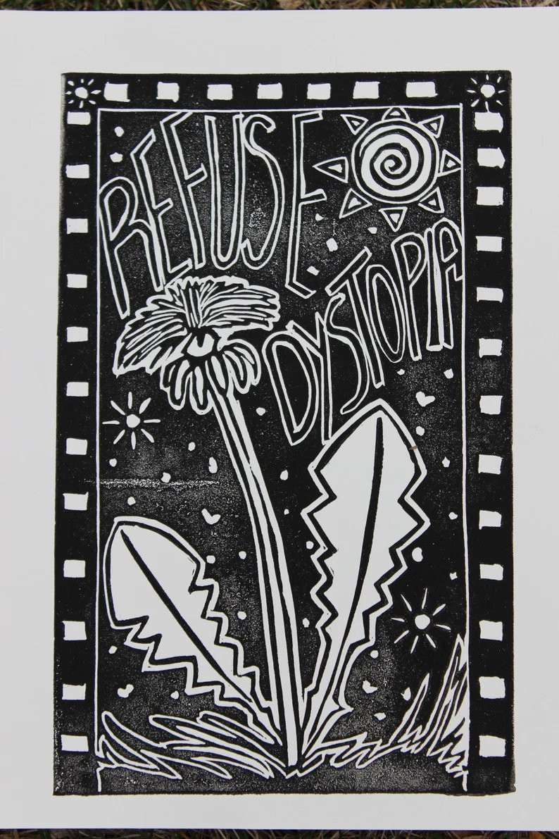 Image of a linocut blockprint by artist suprsaturatd.
A dandelion flower on a background with a bright stylized sun in the background.  The text reads "REFUSE DYSTOPIA"