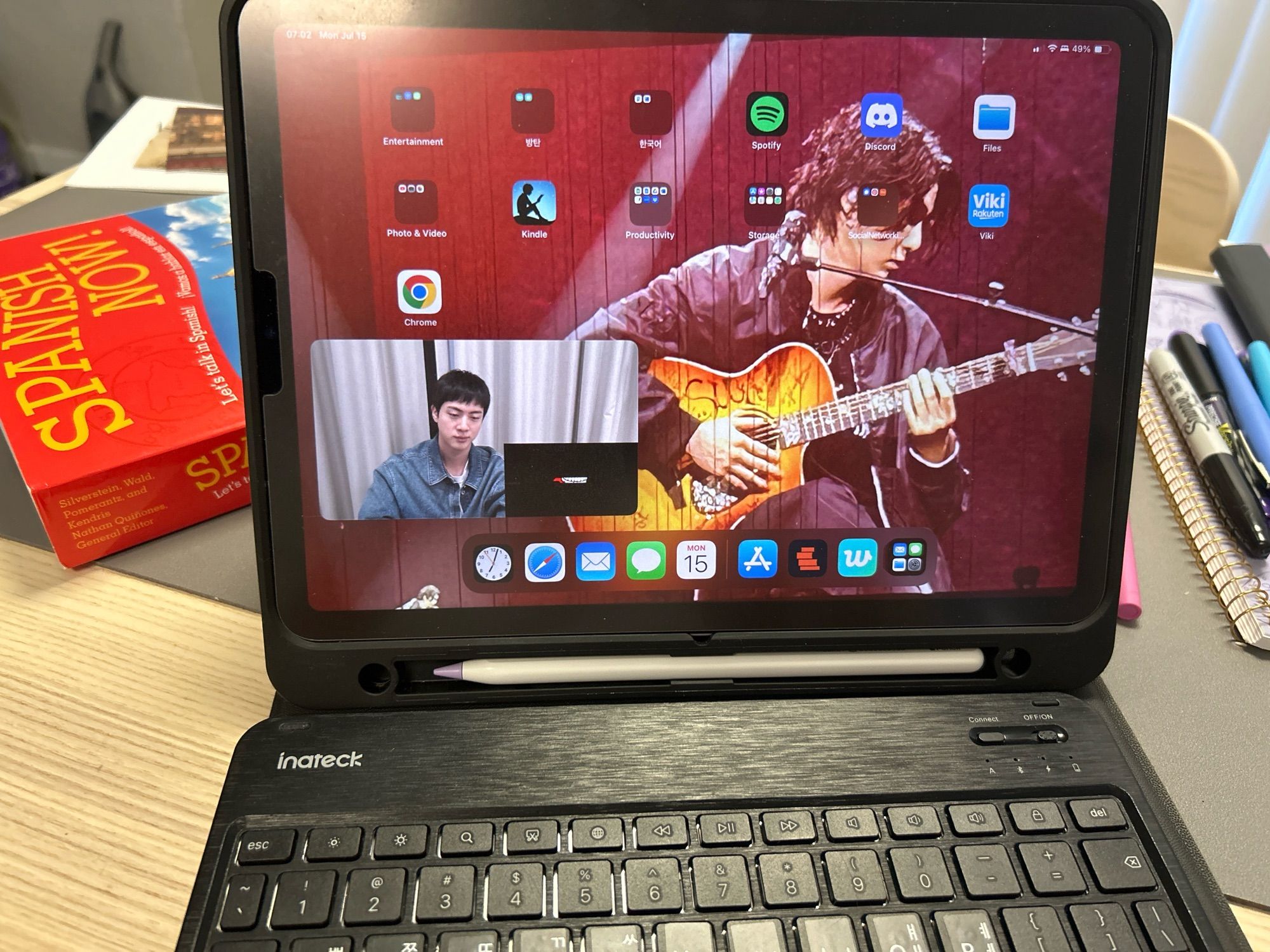 Photo of OP’s landscape iPad showing Jin from BTS playing a video game PIP. The iPad is in a case with a keyboard. (Mostly because this was the only way I could get WeVerse to play in landscape mode.)