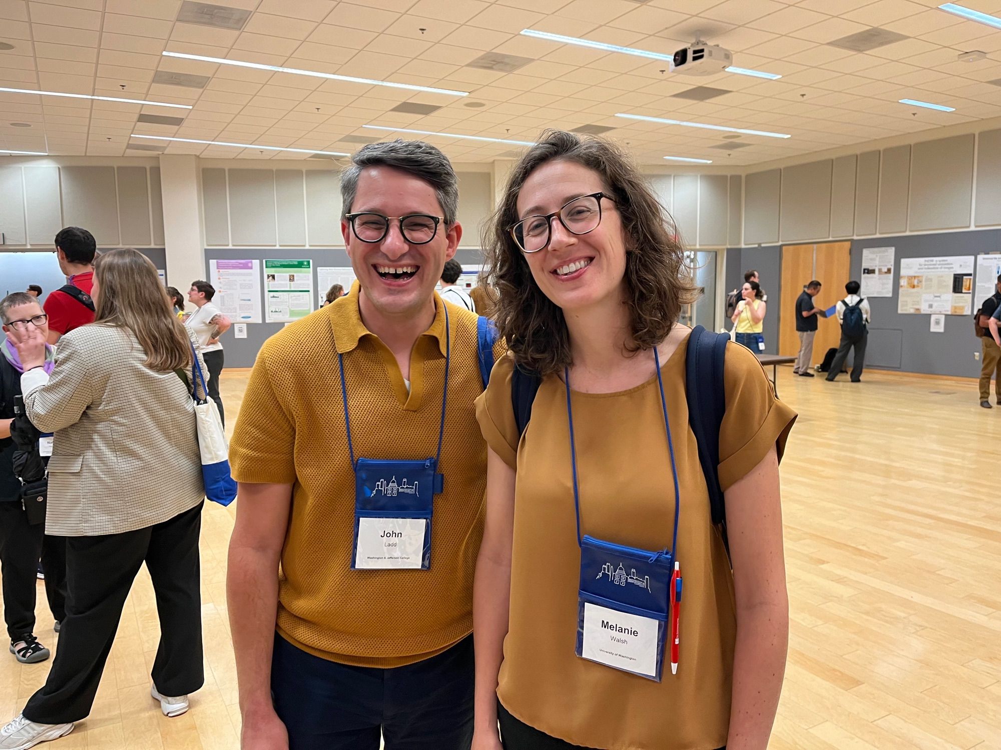 Two grad school buddies in identical shades of millennial mustard