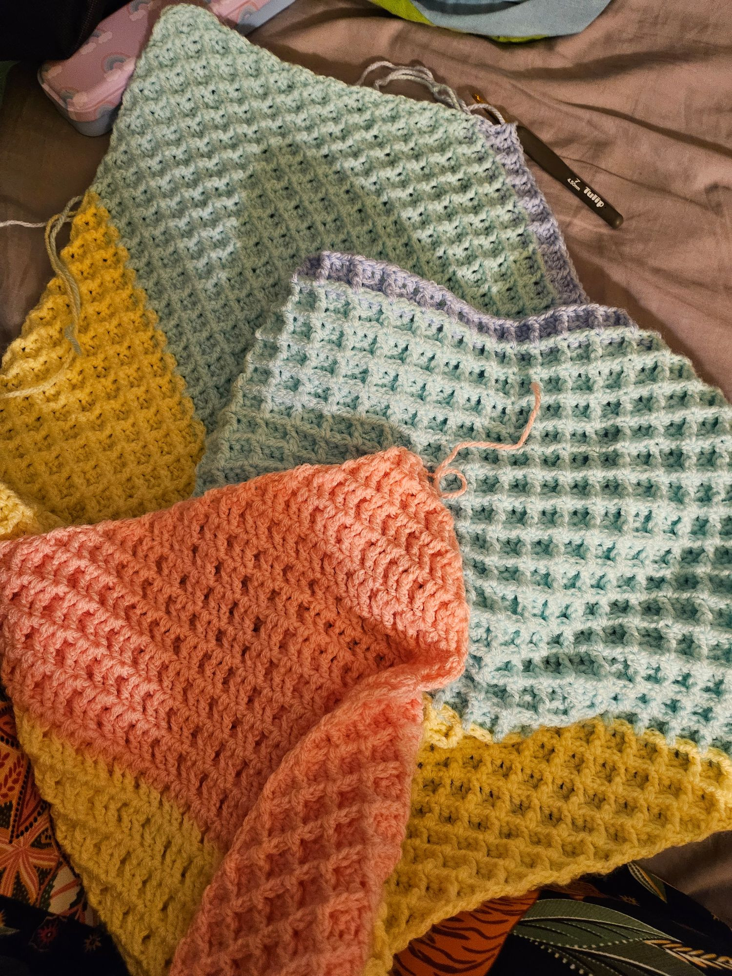 C2C waffle stitch blanket now with a new color added to the coral, yellow, mint: pale blue