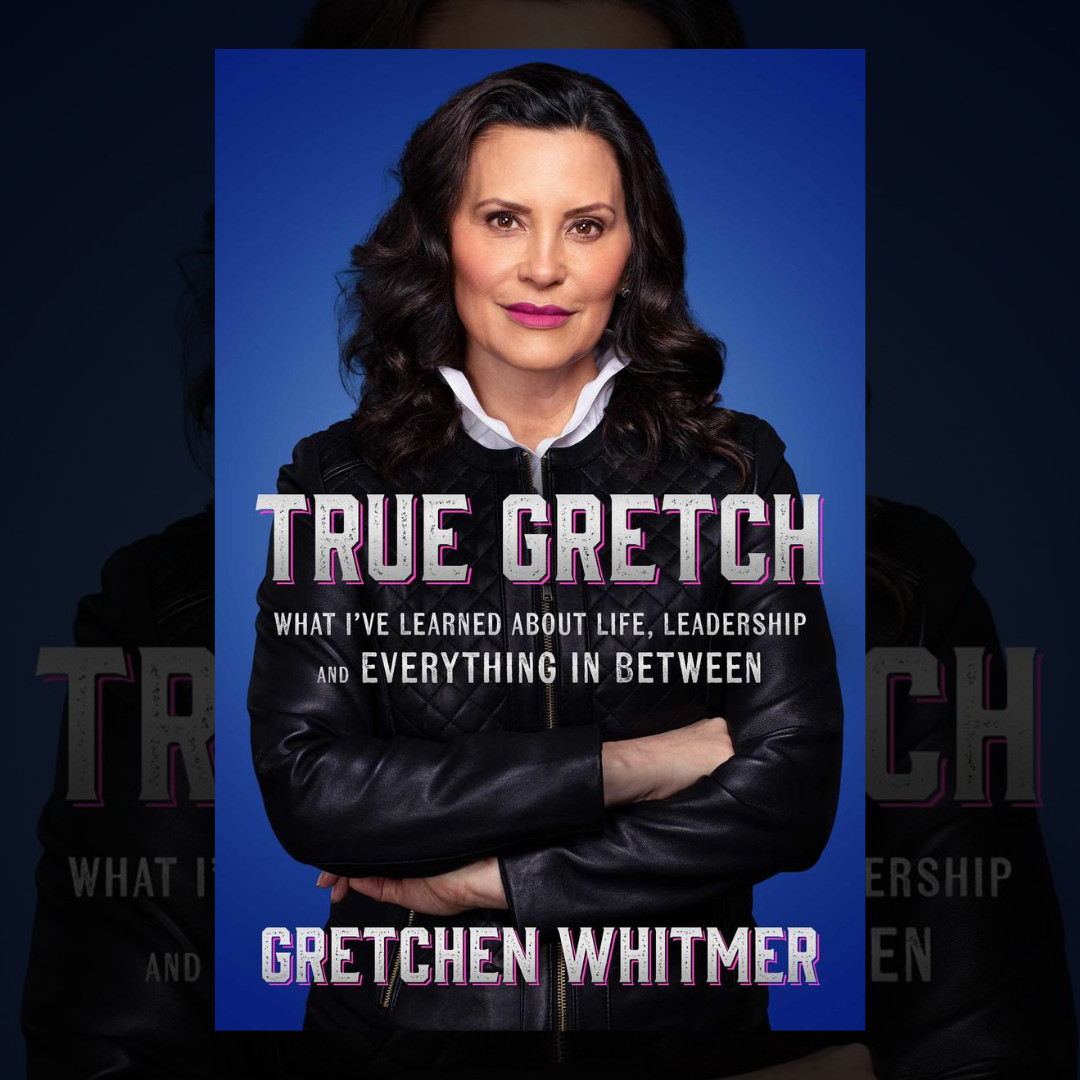 Cover of True Gretch by Gretchen Whitmer, in which the author stands with her arms crossed wearing a black jacket, looking hardcore