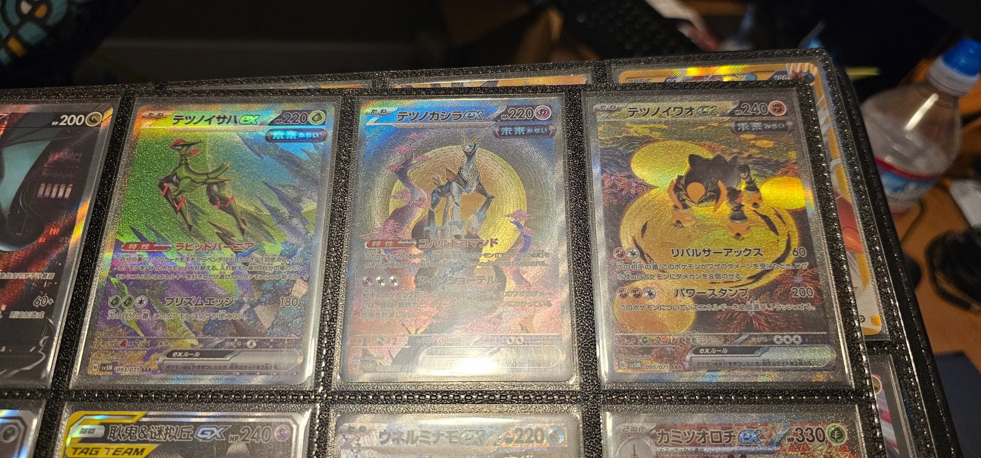 Japanese pokemon cards featuring the trifecta swords of justice paradox forms--iron leaves, crown and boulder