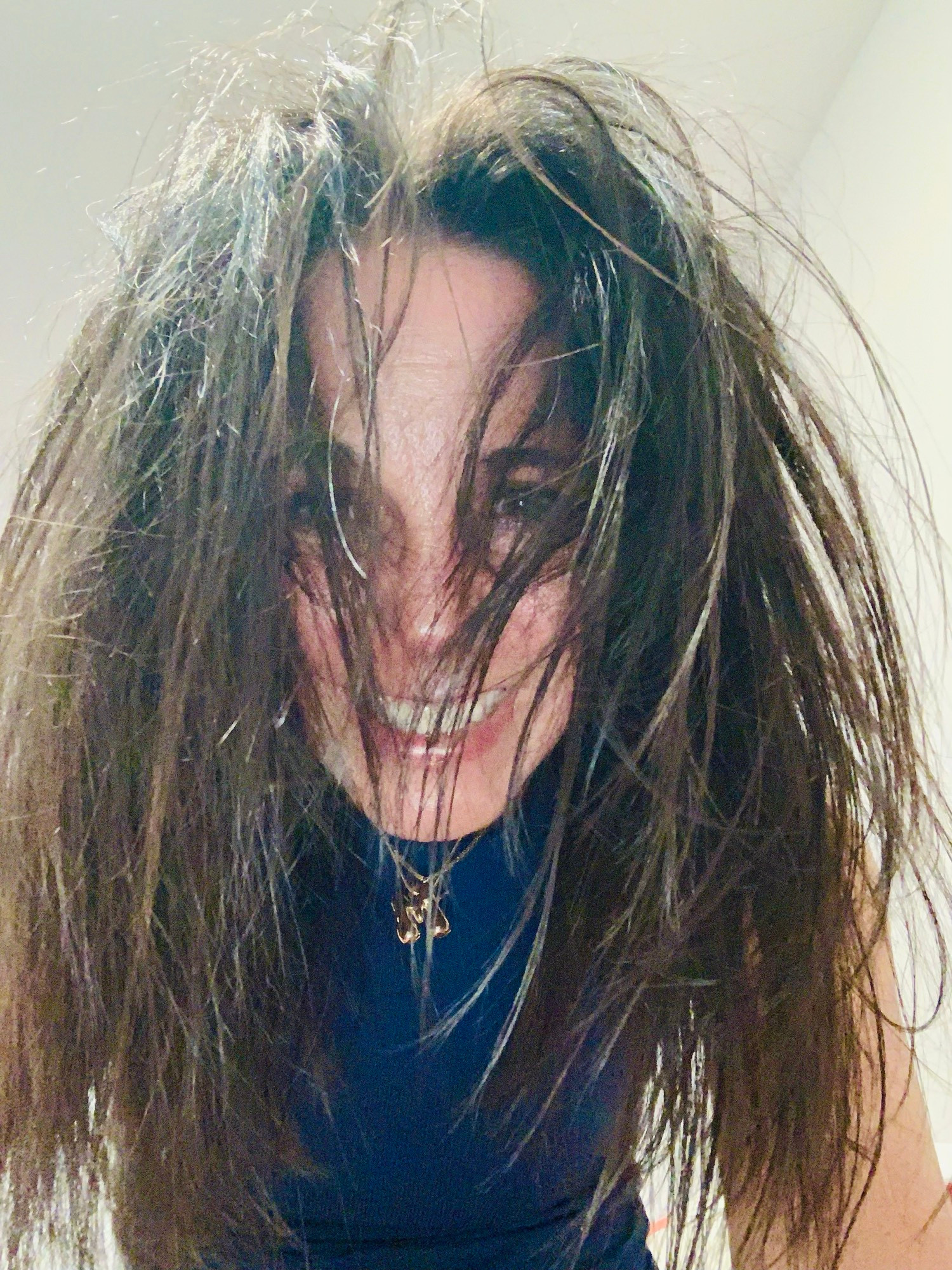 Dark haire woman w her hair in front of her face