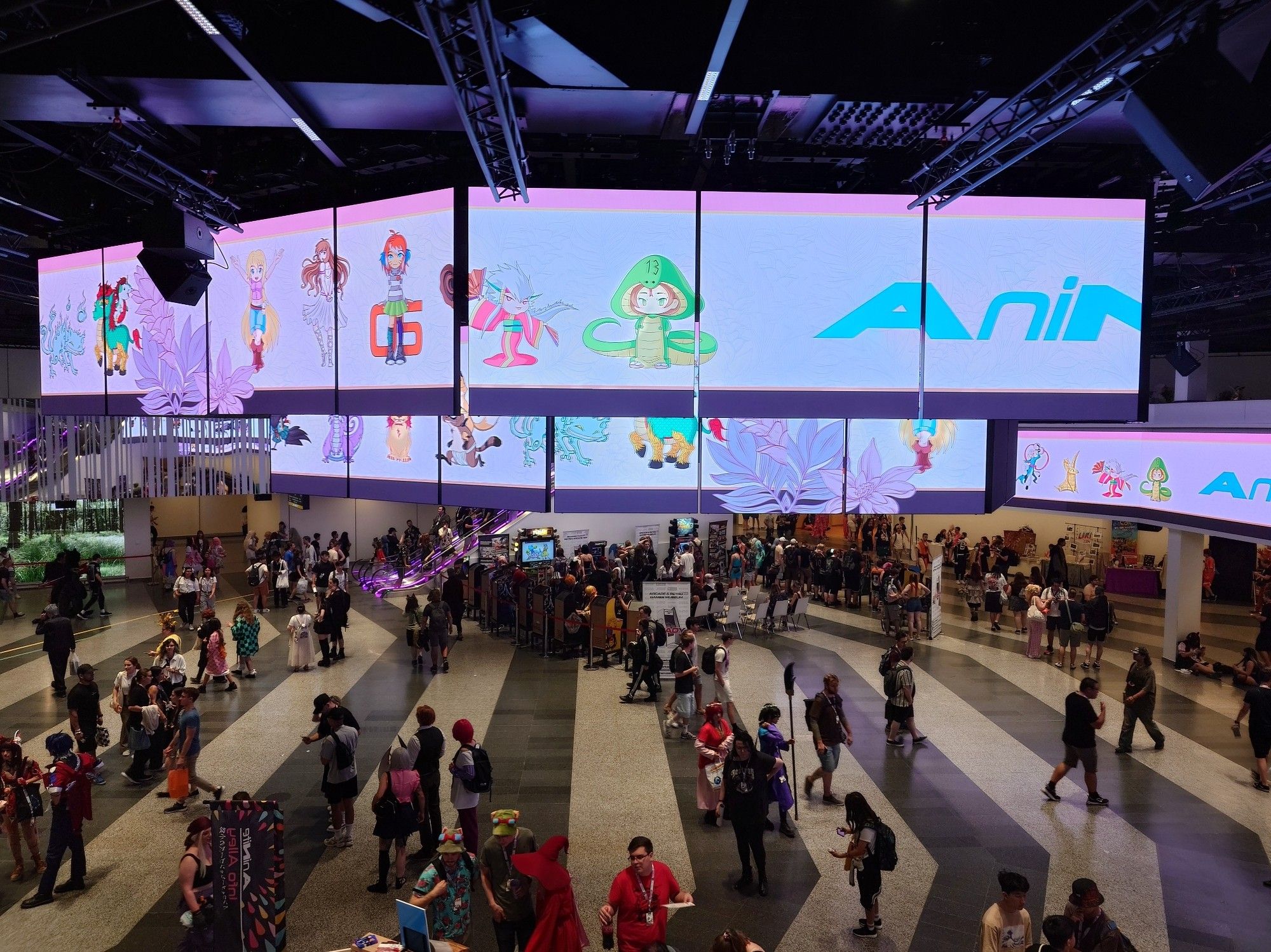 Main lobby of the convention center with digital screen banners