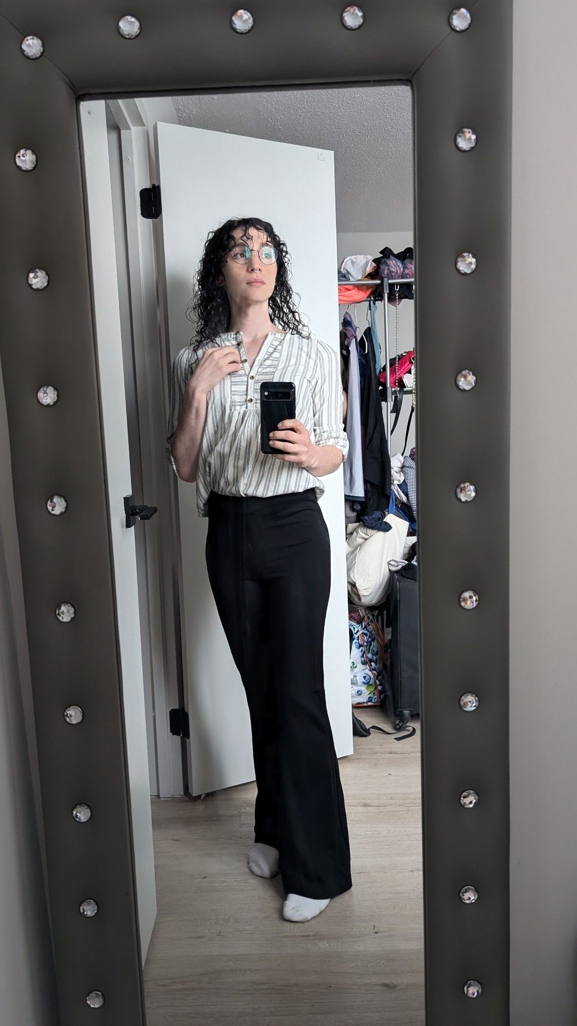 bee mirror selfie in flared slacks and a french tucked dress shirt