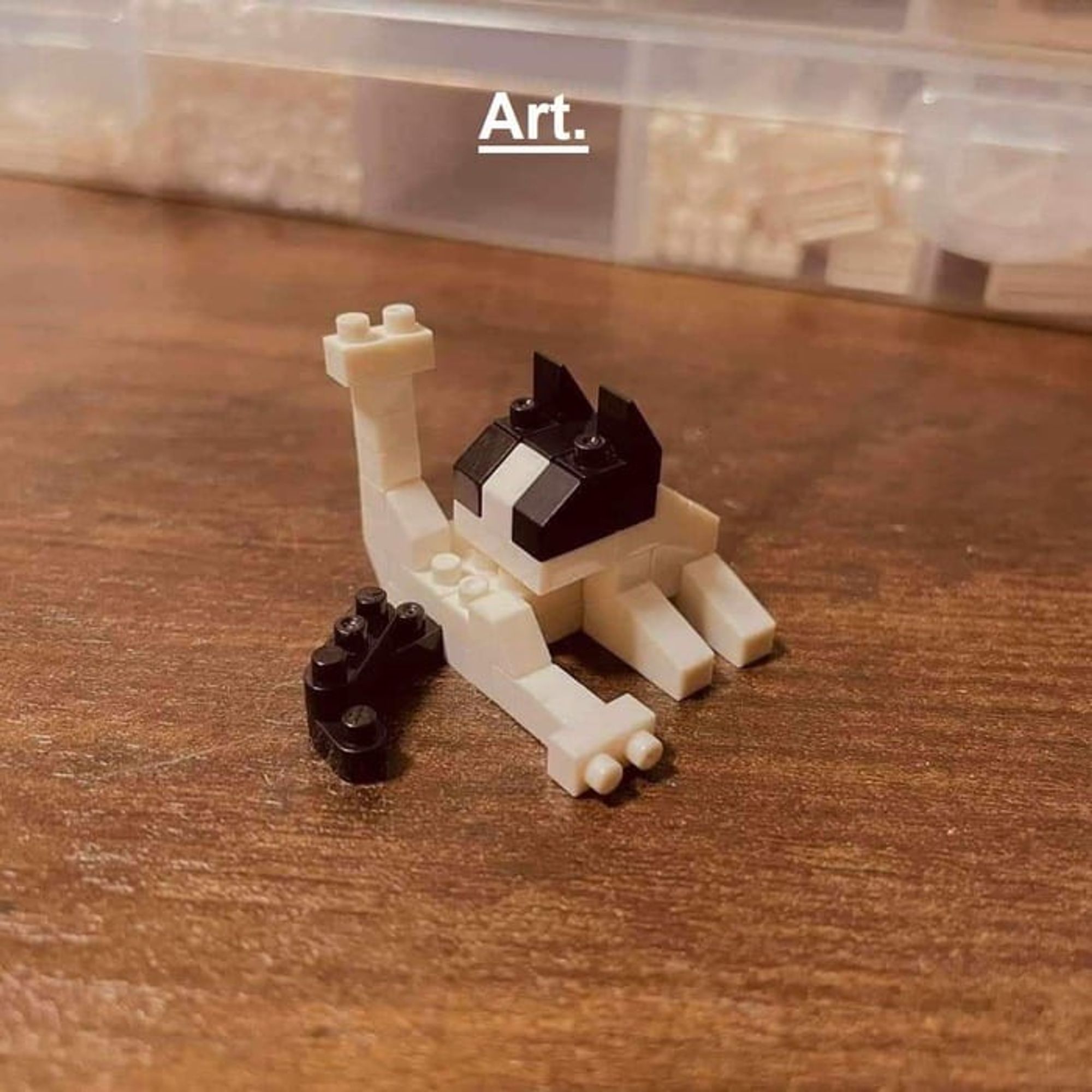 “Art” a cat made from LEGO who’s washing itself 