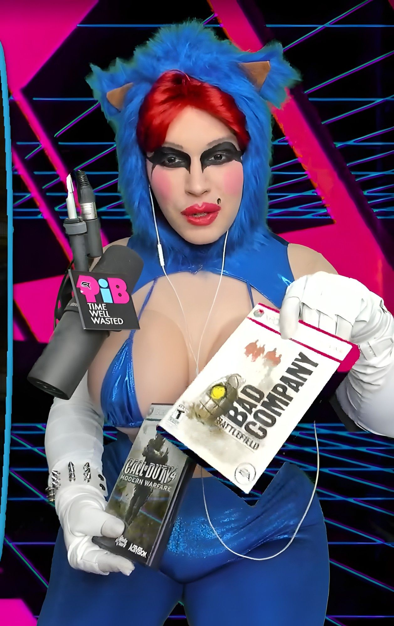 QueenPiB holding a copy of Battlefield Bad Company, and Call of Duty 4: Modern Warfare