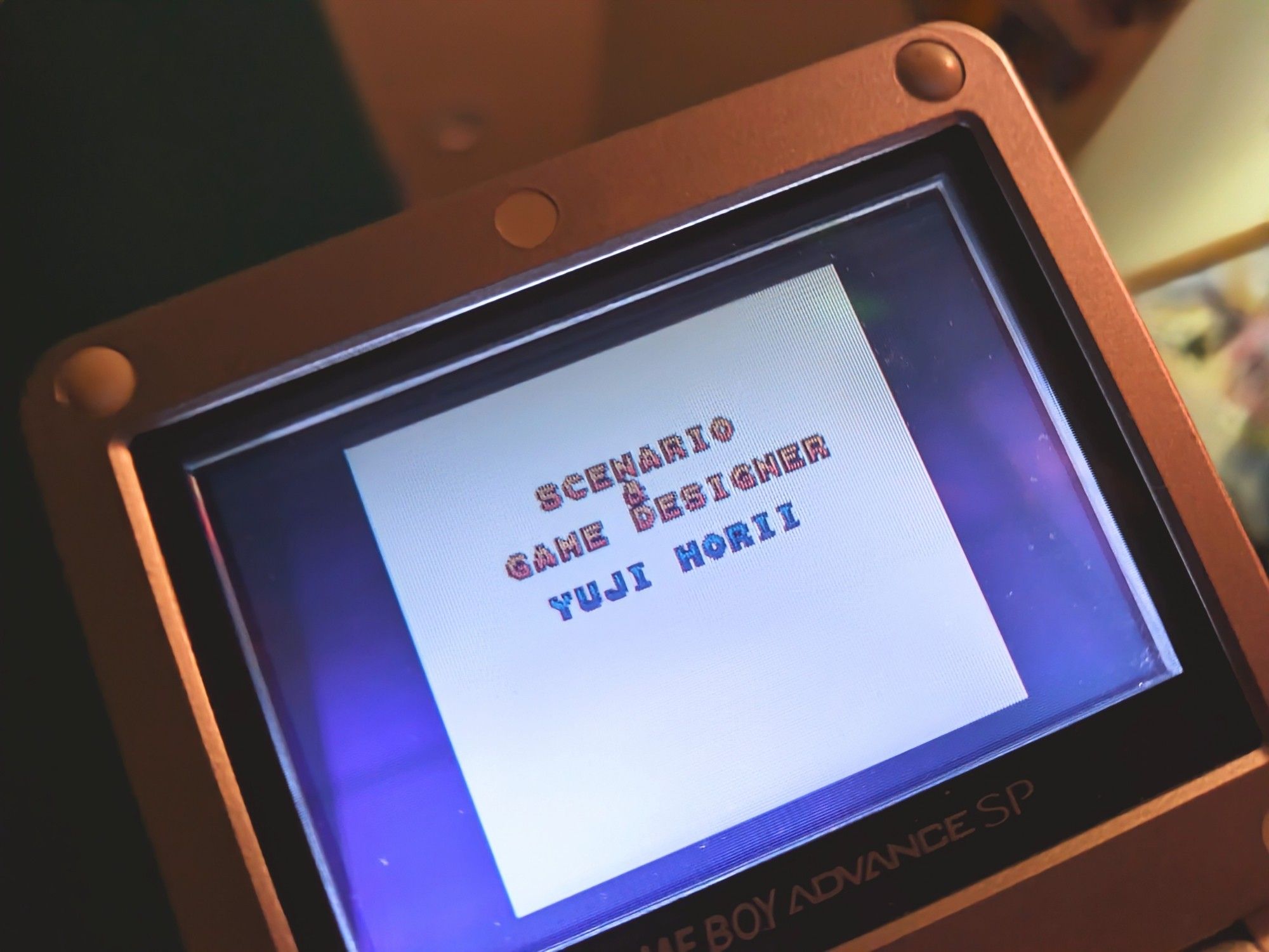 The credits for Dragon Quest 1 (Dragon Warrior 1&2) on a Game Boy Advance SP. Game Designer Yuji Horii shown.