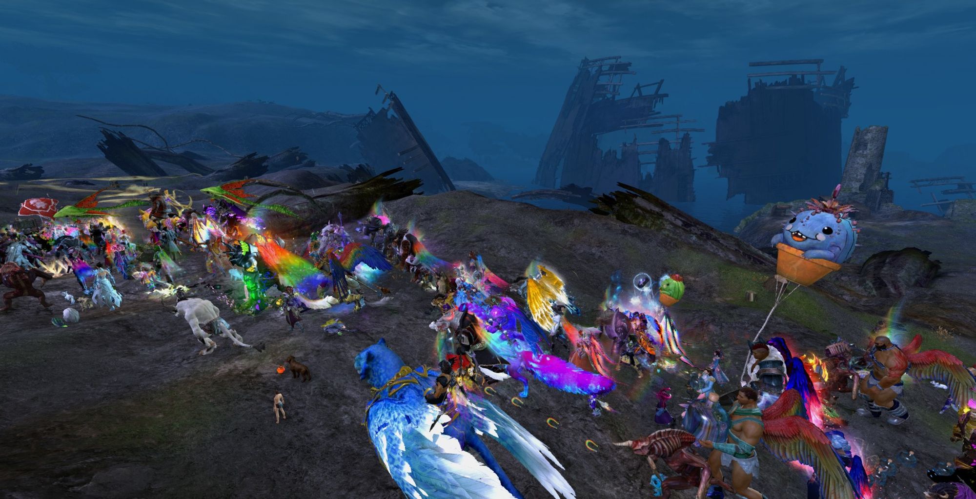 A Guild Wars 2 screenshot of the Tyria Pride March passing through the ruins of the Nightmare Tower.