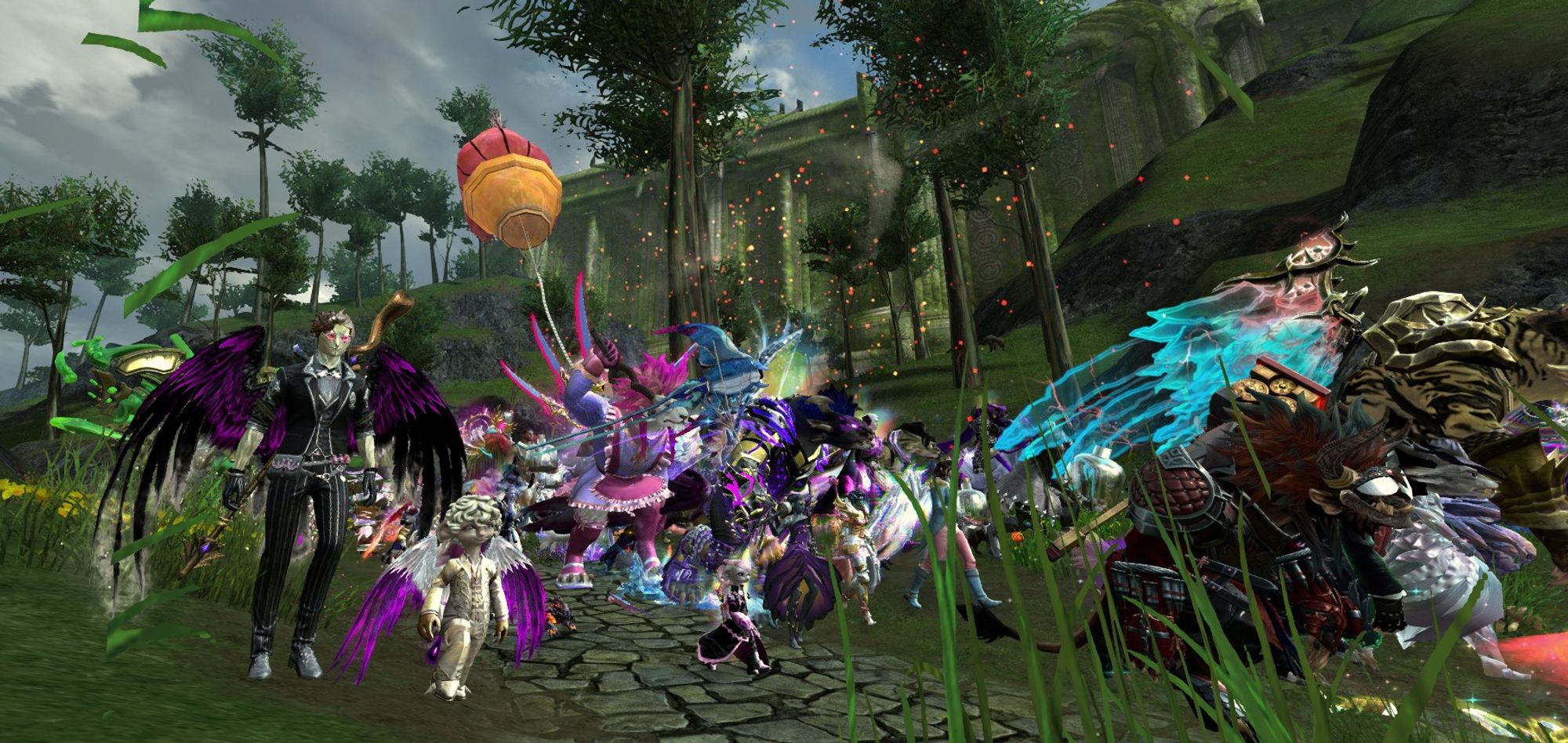 A Guild Wars 2 screenshot of the Tyria Pride March trekking through Kryta. In the foreground, there is a sylvari and an asura cosplaying as Crowley and Aziraphale from Good Omens.