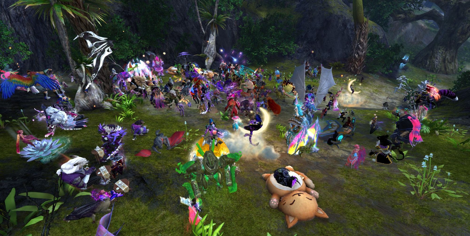 A Guild Wars 2 screenshot of the Tyria Pride March taking another break on the outskirts of Brisban Wildlands. Some are sitting or laying around on various chairs (including a moon and a cat bed). Some are having a mini tea party. Even more are having a dance party.