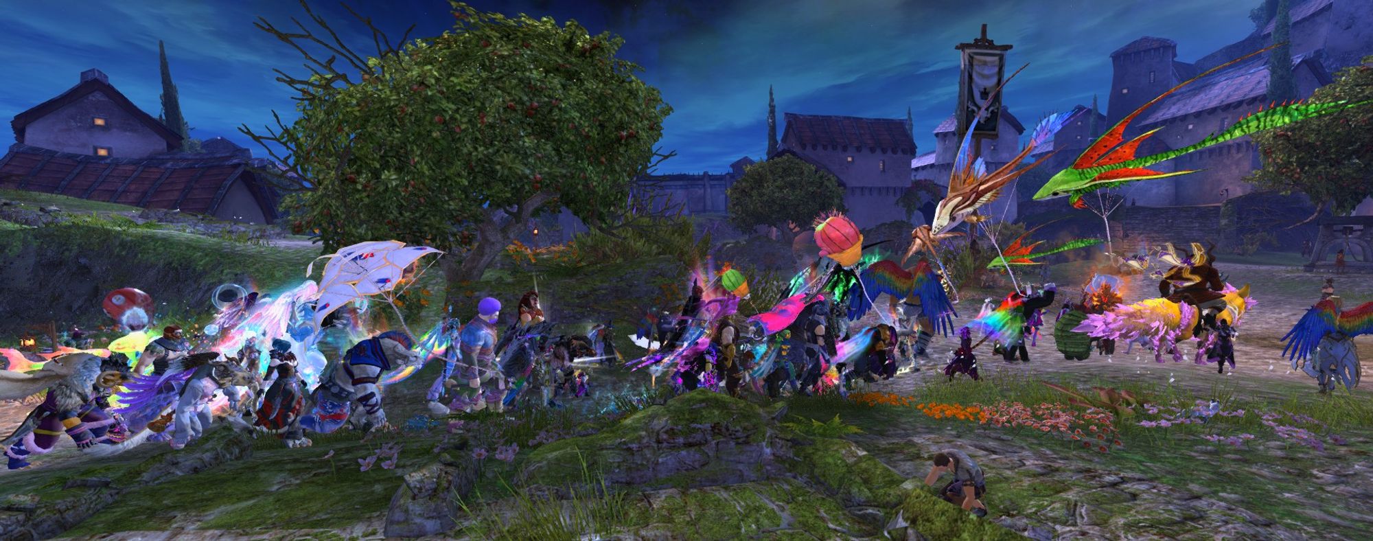 A Guild Wars 2 screenshot of the Tyria Pride March trekking through a settlement in Kryta with various balloons and kites.