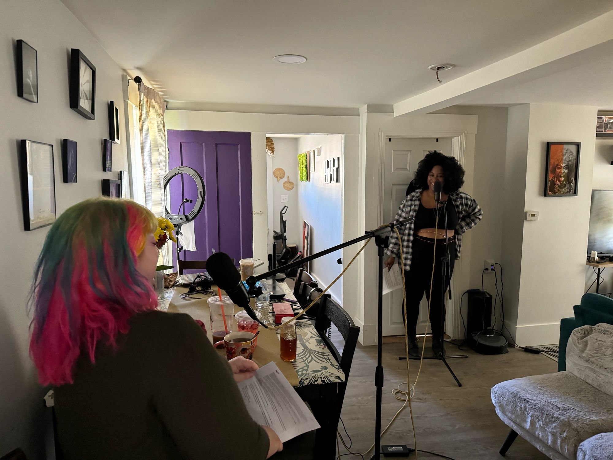 Journey and valentine laughing each other as they record dialogue