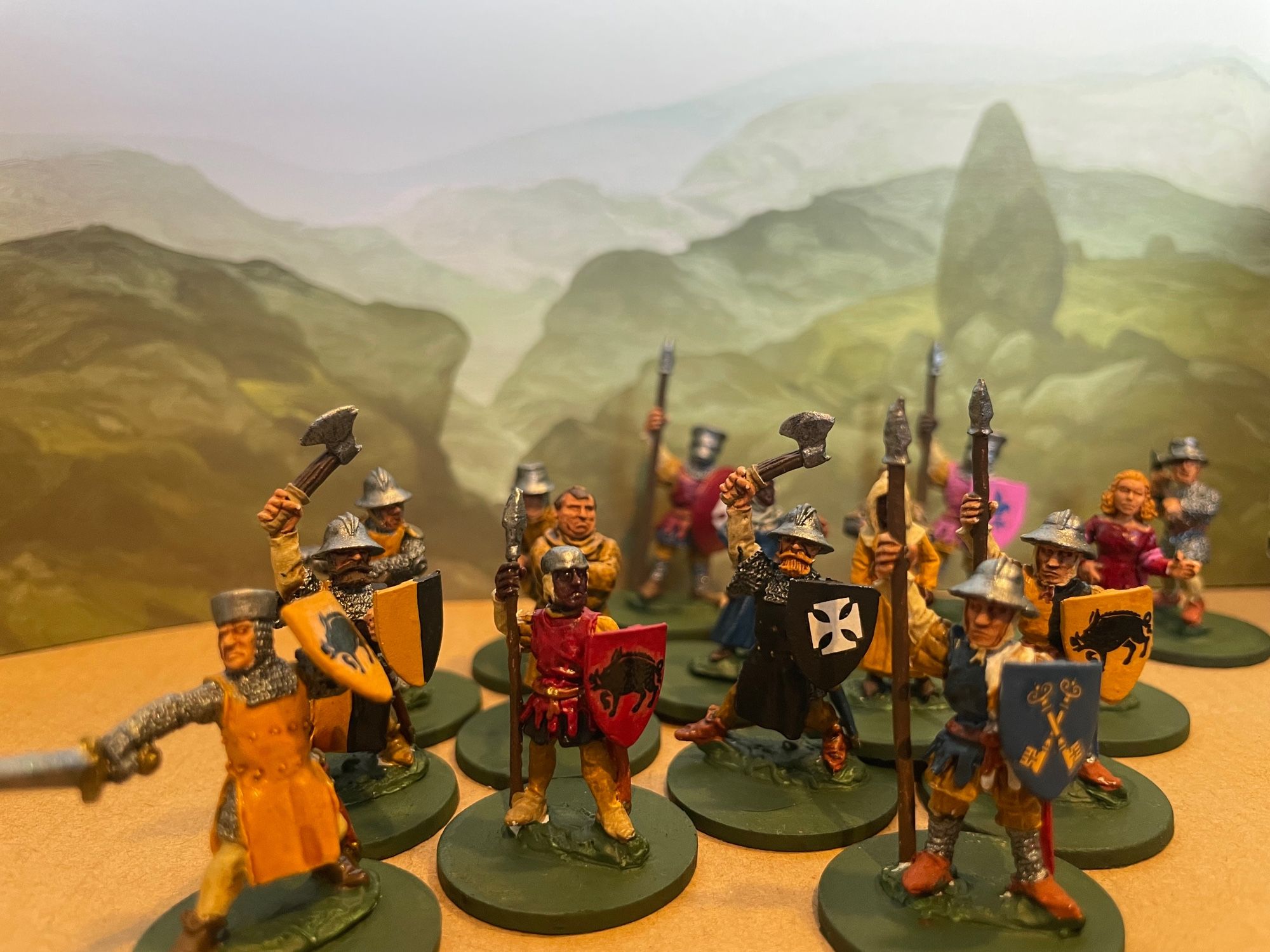 Medieval men at arms and peasants await bold adventurers.