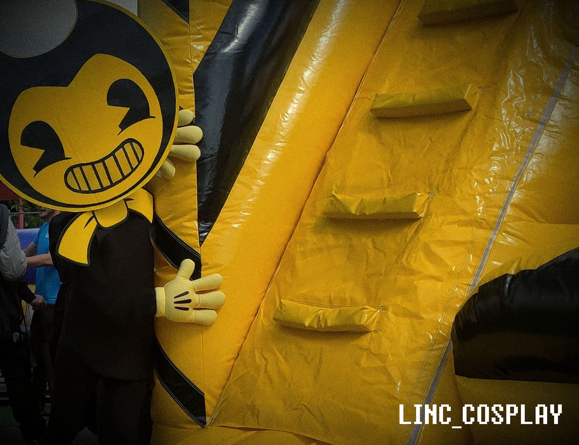 Bendy does peek-a-boo at an inflatable castle.