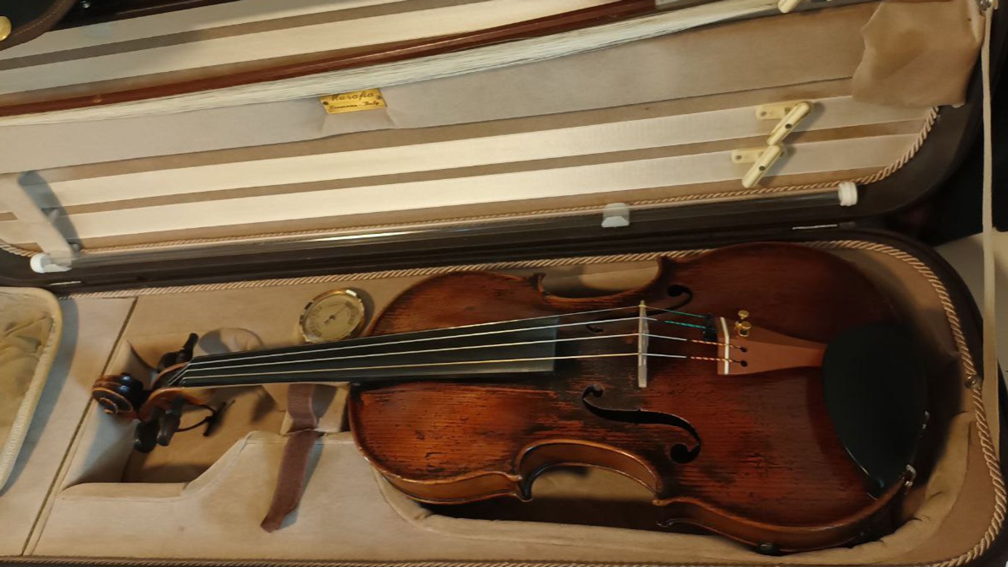 A late 18th century violin in her case.