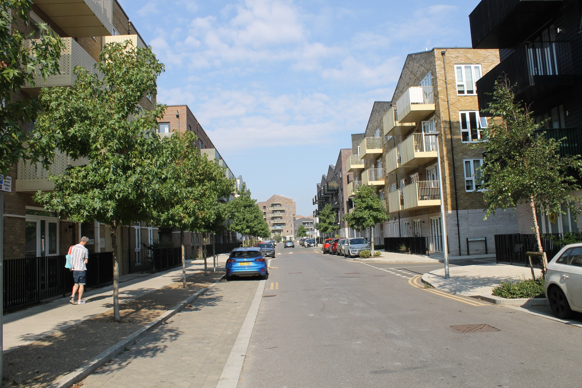 Cory Rd lined by 4 storey apartments with balconies and design coded to for planting and parking both sides