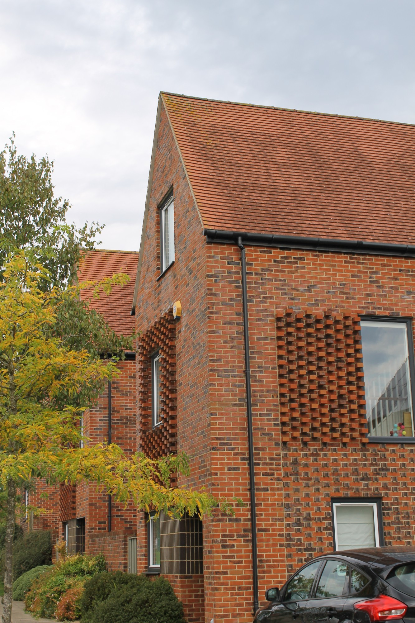 detail of Proctor and Matthews trademark brick patterning on house walls that adds character