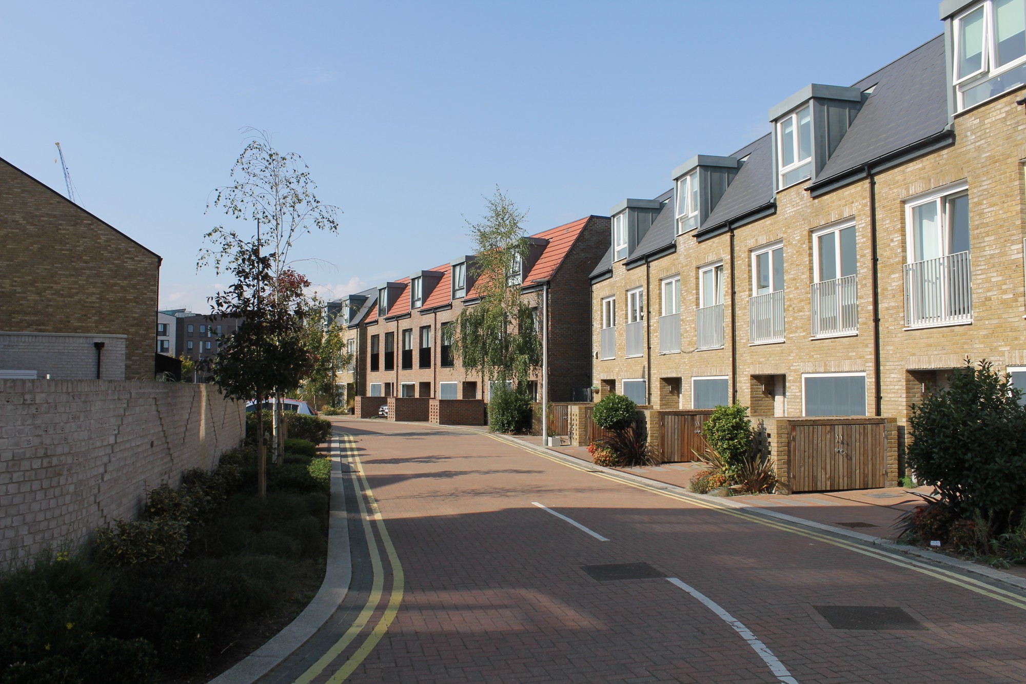 3 storey homes with integral garages. Square dormer windows