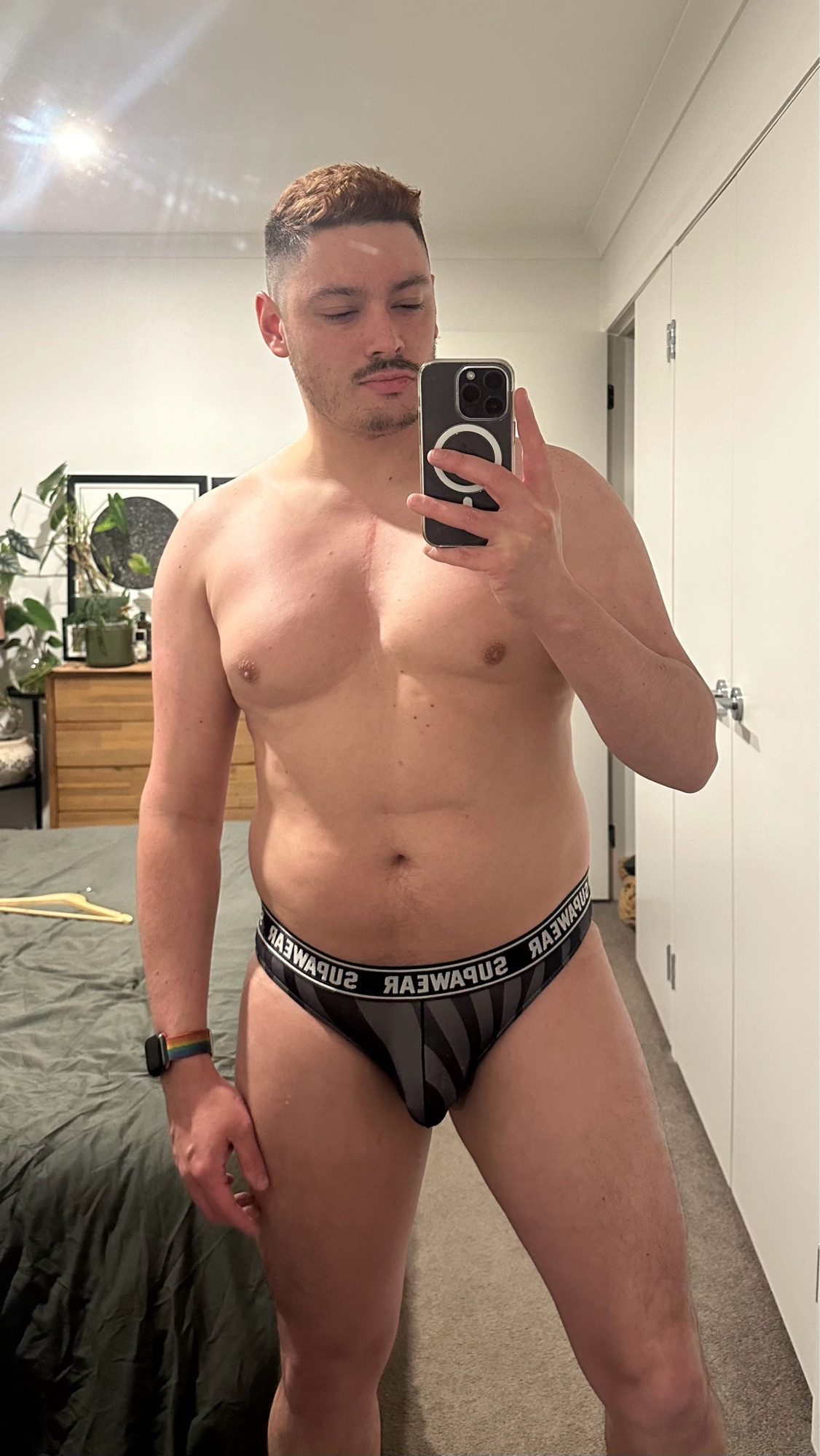 Mirror selfie wearing black and grey tiger striped Supawear briefs