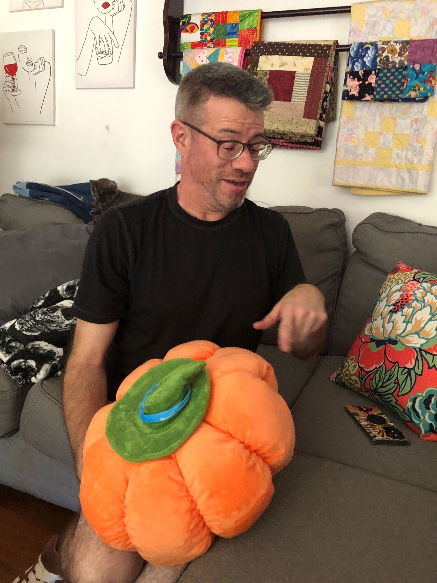 A middle aged man discovers the second hole on the slide of the pumpkin