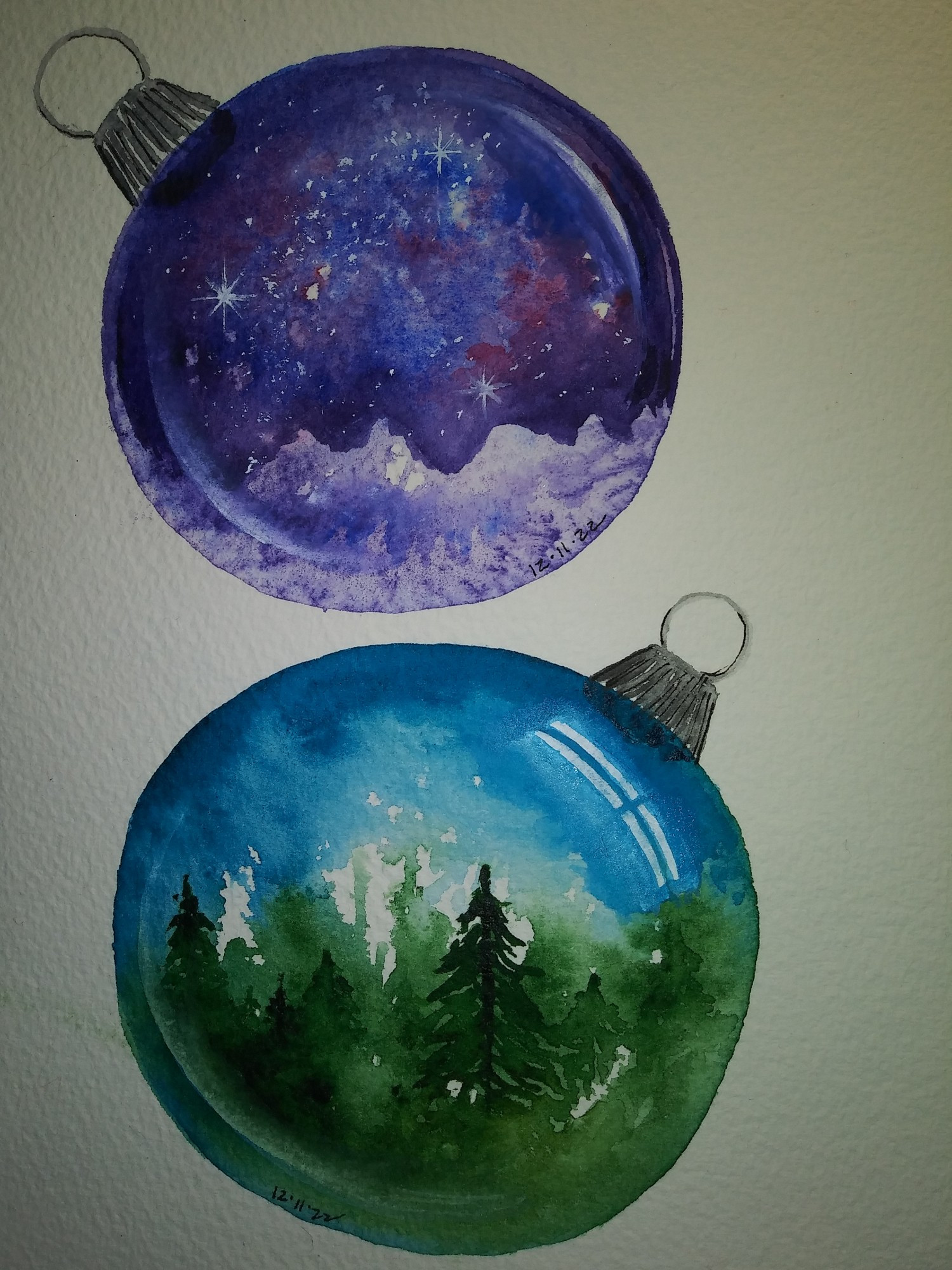 A white piece of watercolor paper with two fantasy Christmas ornaments painted in watercolor. The ornaments are clear glass, with the typical metal cap and round wire loop to attach a hanger. A landscape scene is painted inside of each ornament. The top ornament has a fantastic nebula sky. Soft reds and violets mingle among deep indigo spaces and many stars. At the horizon, we see a distant, snow-covered mountain range.. In the foreground, a line of snow-covered pine trees stands out against the violet mountains.

The lower ornament is a daytime scene with a pretty, sunlit sky and a soft wash of white clouds. It is a green forest, with most of the trees in soft focus. One tree, just right of center and at about middle distance, is darker and stands out in more detail.

 Painted highlights remind us we are looking into glass spheres. Both are painted with watercolor and gouache. The page they are painted on is 6" x 9".